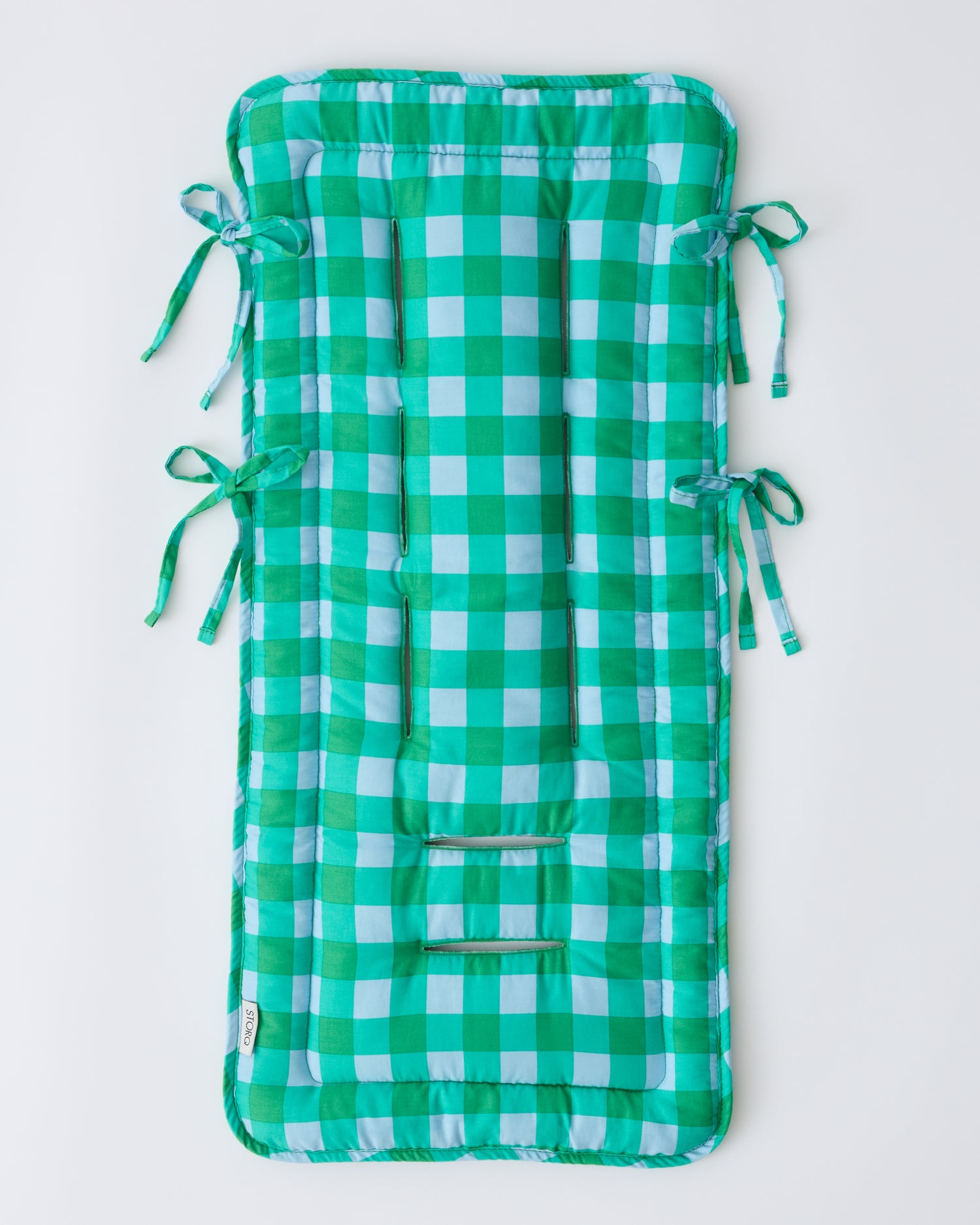 Front side of Stroller Party™ Seat Liner in Teal Gingham on a beige background.