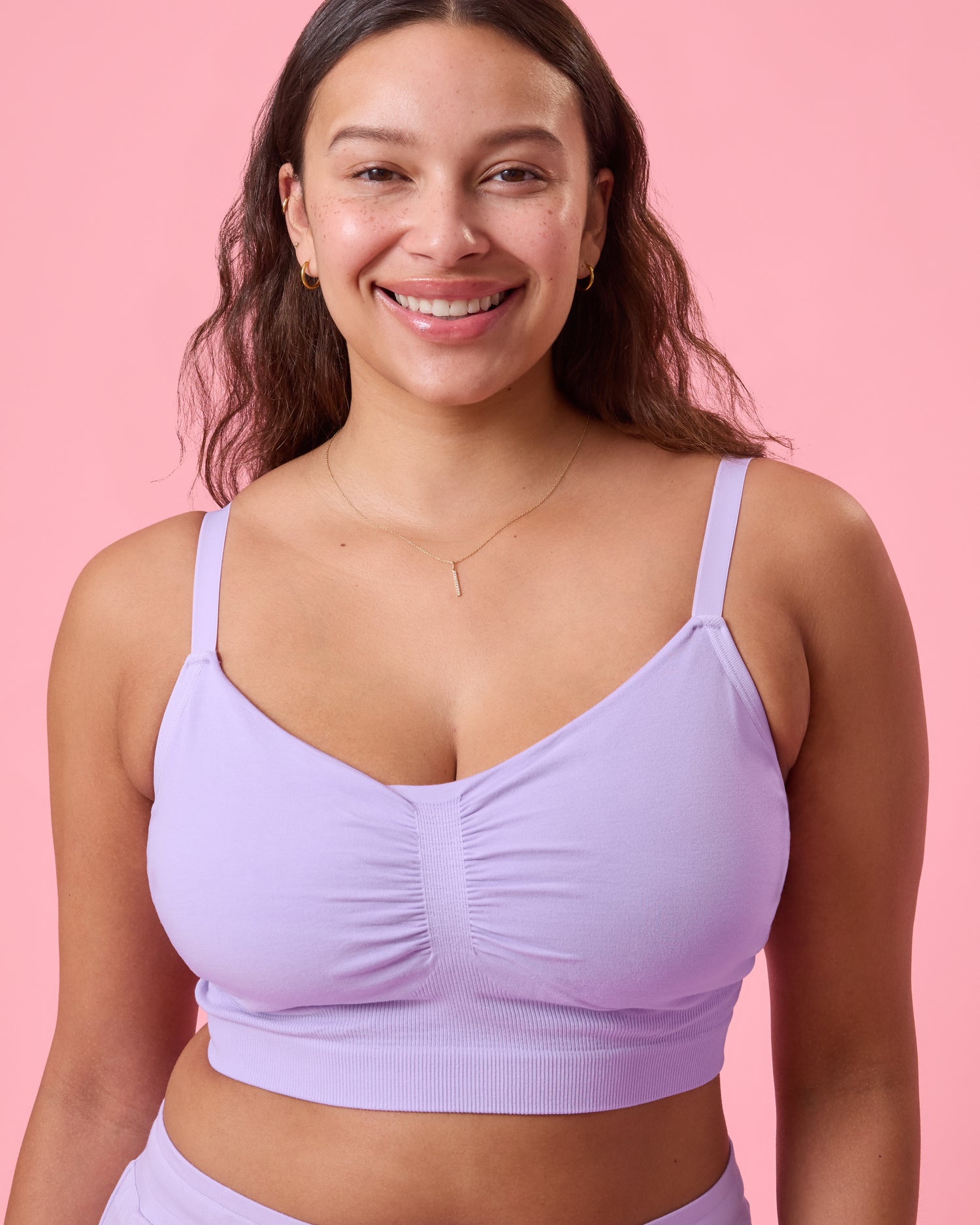 Front view of model wearing Sublime Bamboo Hands-Free Pumping Lounge & Sleep Bra in Lavender on a pink background@model_info:Alana is wearing a Large.