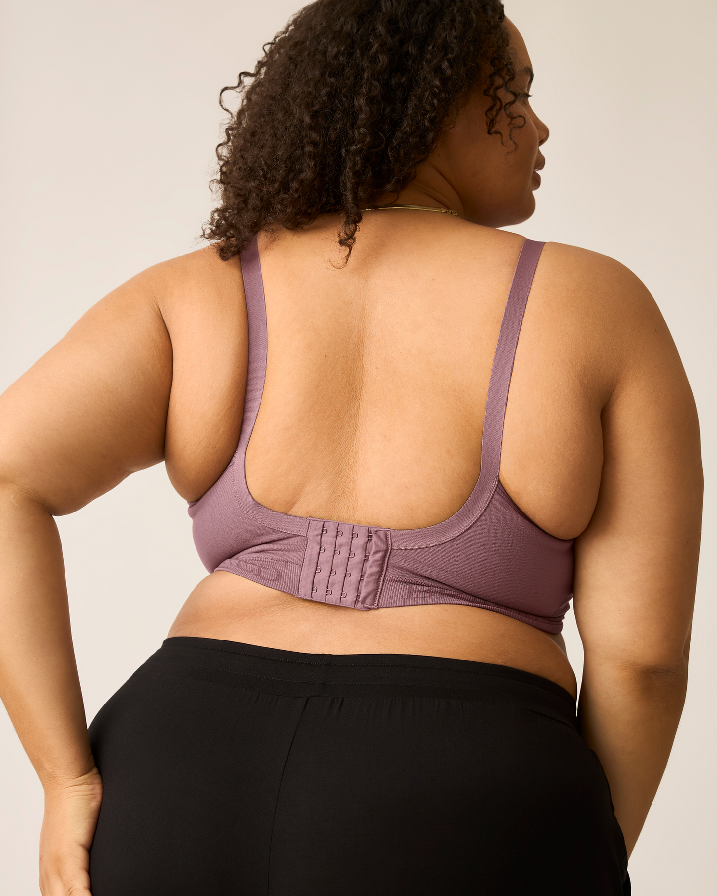 Woman wearing the Signature Sublime® Contour Hands-Free Pumping & Nursing Bra in Twilight, showing back of bra