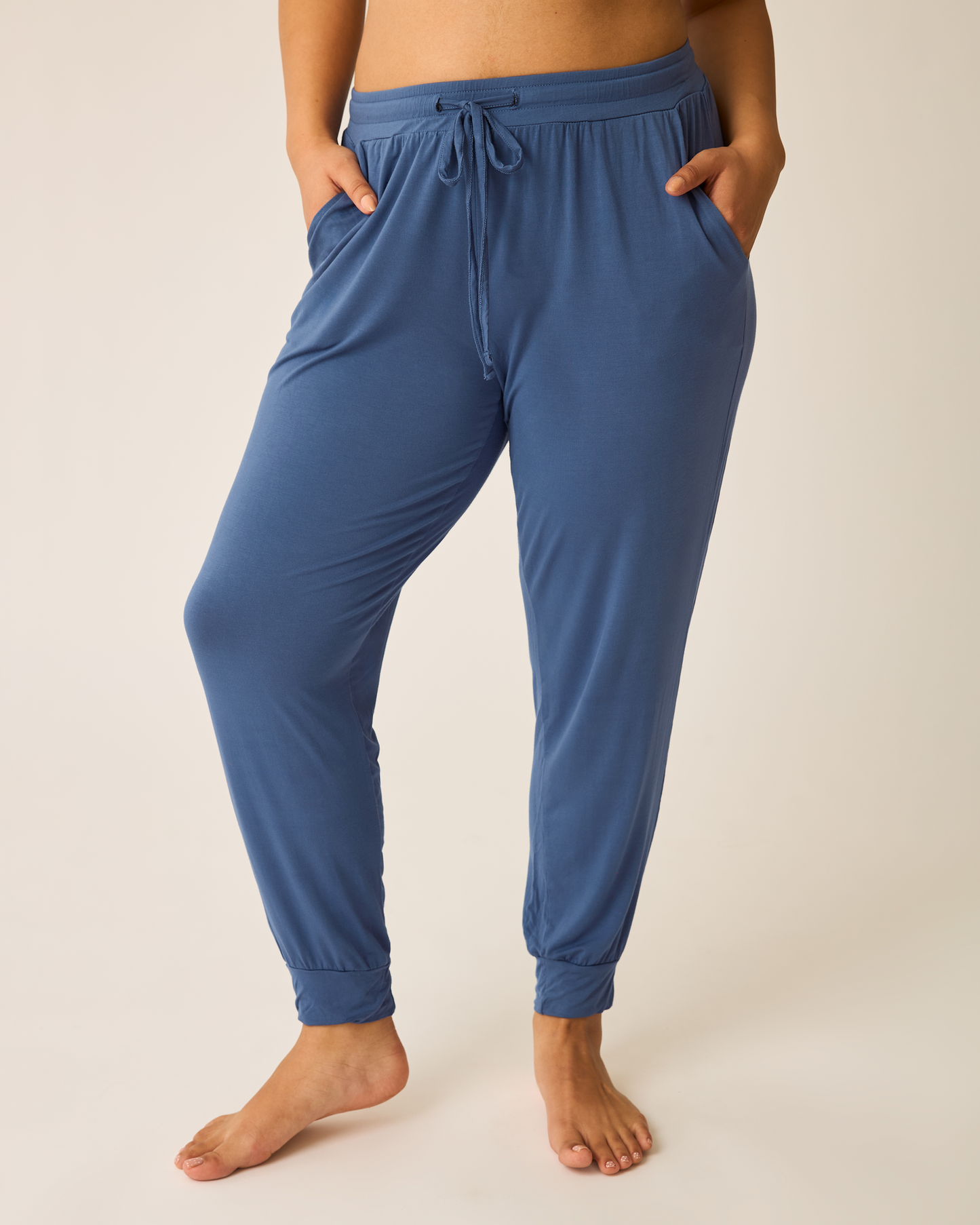 Woman wearing the Everyday Lounge Jogger in Slate Blue.@model_info:Amber is 5'7" and wearing a Large.