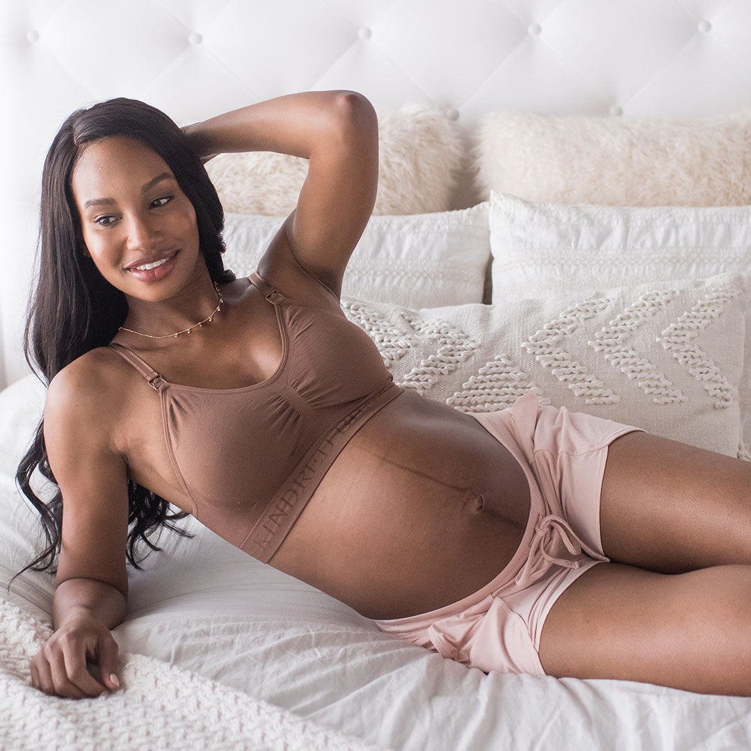 Model laying on her side wearing the Simply Sublime® Nursing Bra | Mocha