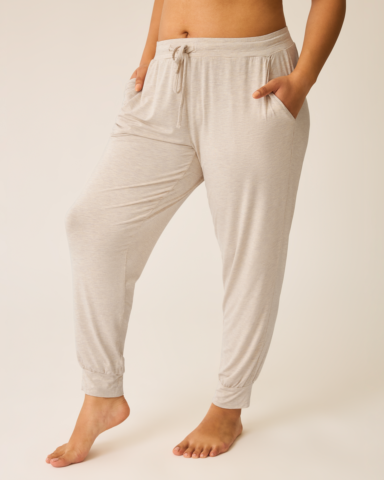 Model wearing the Everyday Lounge Jogger in Oatmeal Heather@model_info:Amber is 5'7" and wearing a Large.