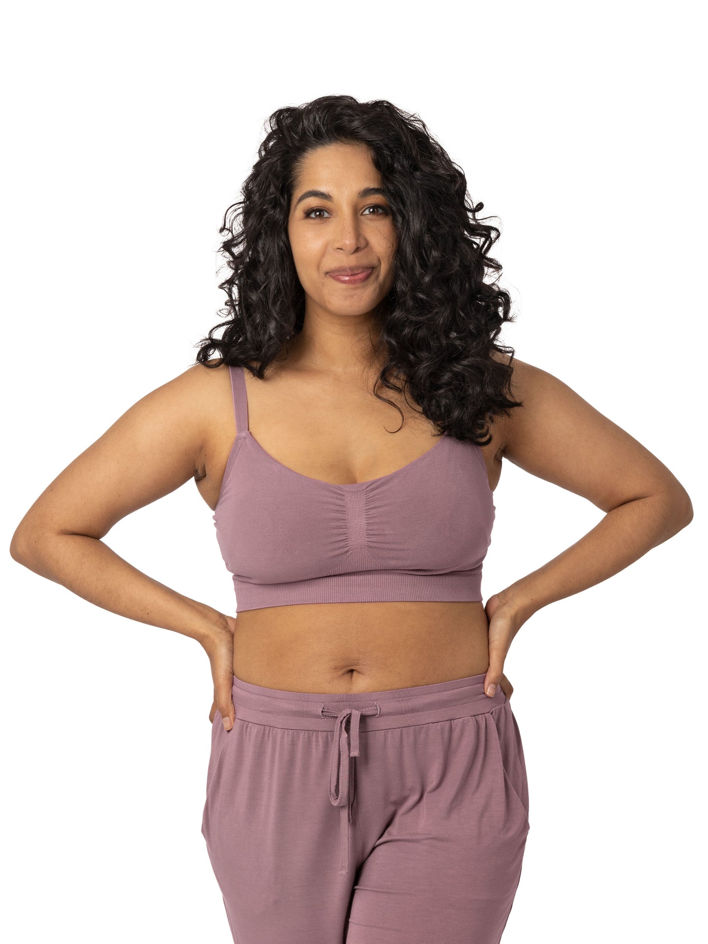 A model wearing the Sublime® Hands-Free Pumping & Nursing Bra in twilight with the matching lounge pants@model_info:Zakeeya is wearing a Small. 