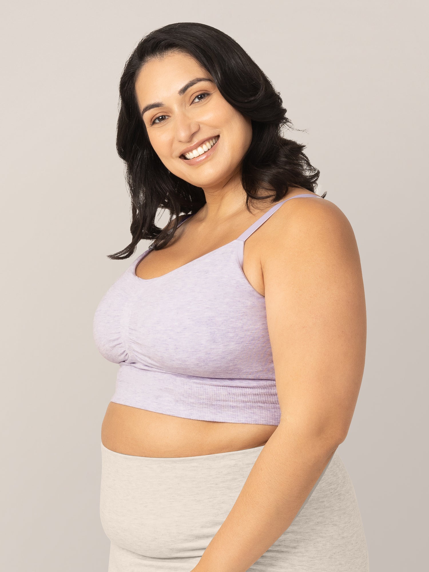 Side view of model wearing the Sublime® Bamboo Hands-Free Pumping Lounge & Sleep Bra in Lavender Heather in a busty fit