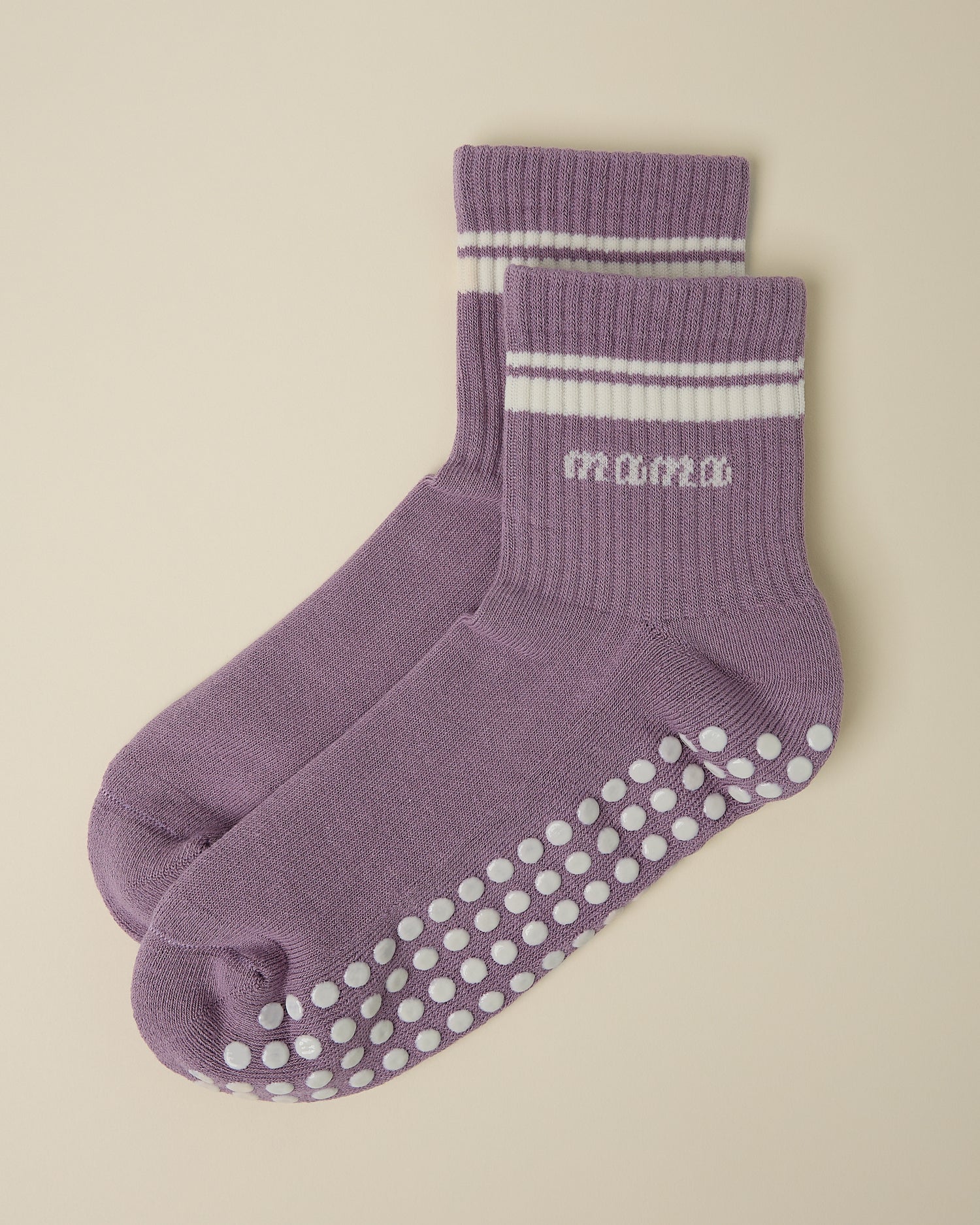 A pair of Non-Slip Quarter Crew Socks in Dusty Mauve & Ivory on a beige background.