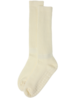 A pair of Non-Slip Slouchy Socks in Cream on a white background.