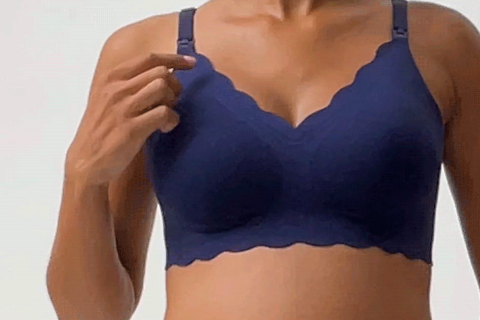 Gif of stylist demonstrating stretchiness of the material on the Bare Bond™ Cotton Maternity & Nursing Bra in Coastal Navy, on a beige background.