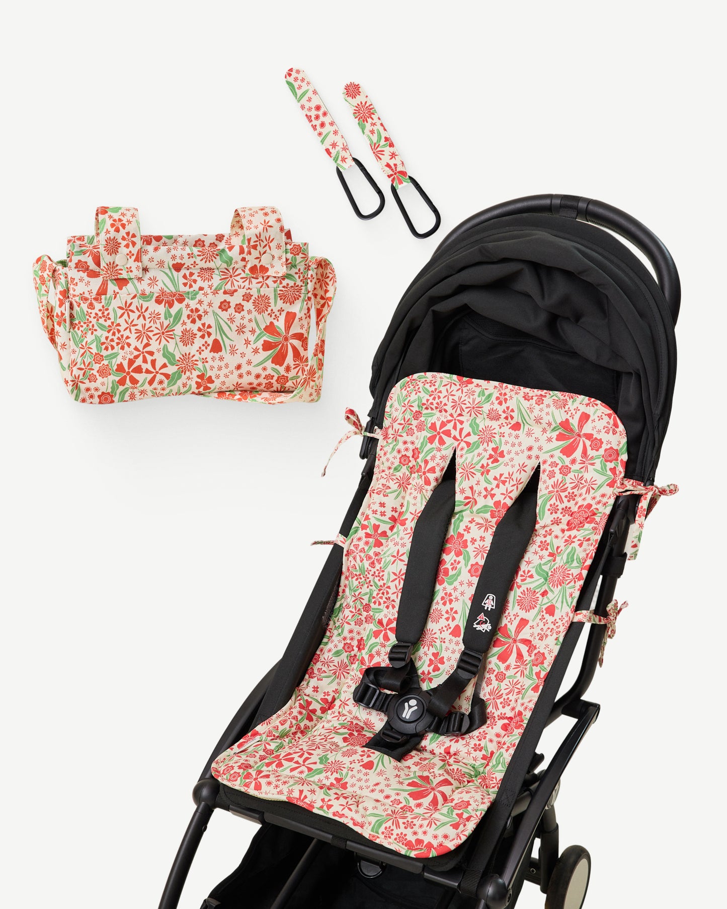 Stroller Party Set in Superbloom, including Stroller Party Seat Liner on a black stroller, Stroller Party Clips (Two-Pack), and Stroller Party Caddy Bag on a white background.