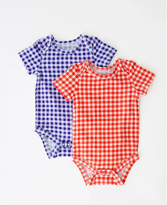 Baby Onesie Two-Pack in Red & Blue Gingham on a beige background