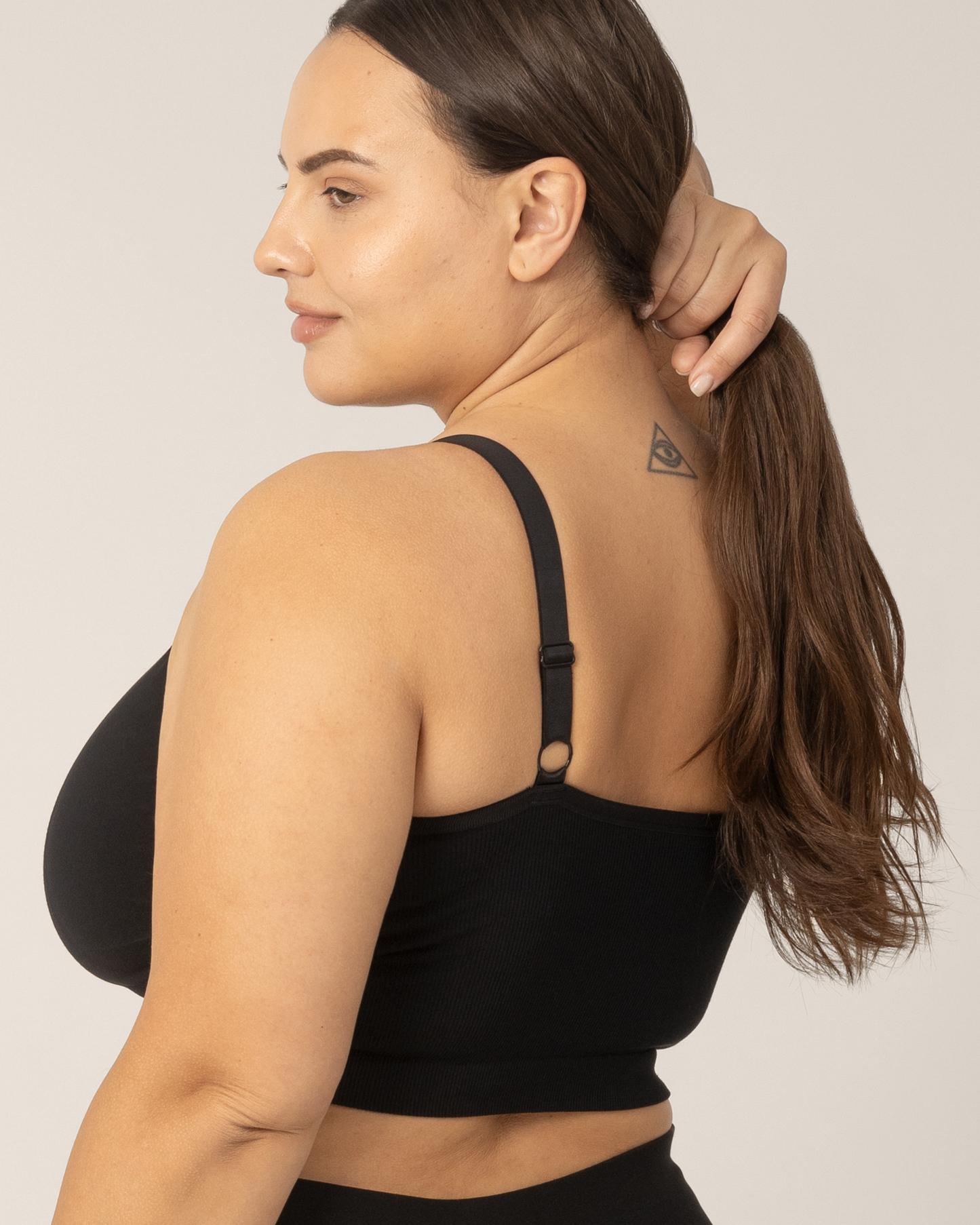 Back side view of woman wearing the Sublime® Bamboo Hands-Free Pumping Lounge & Sleep Bra in Black