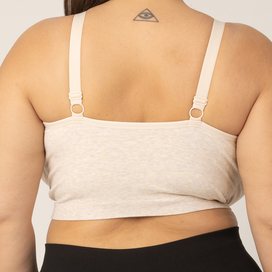 Back view of Side view of Super busty model wearing the Sublime Hands-Free Pumping & Nursing Sleep and Lounge Bra in Oatmeal Heather.
