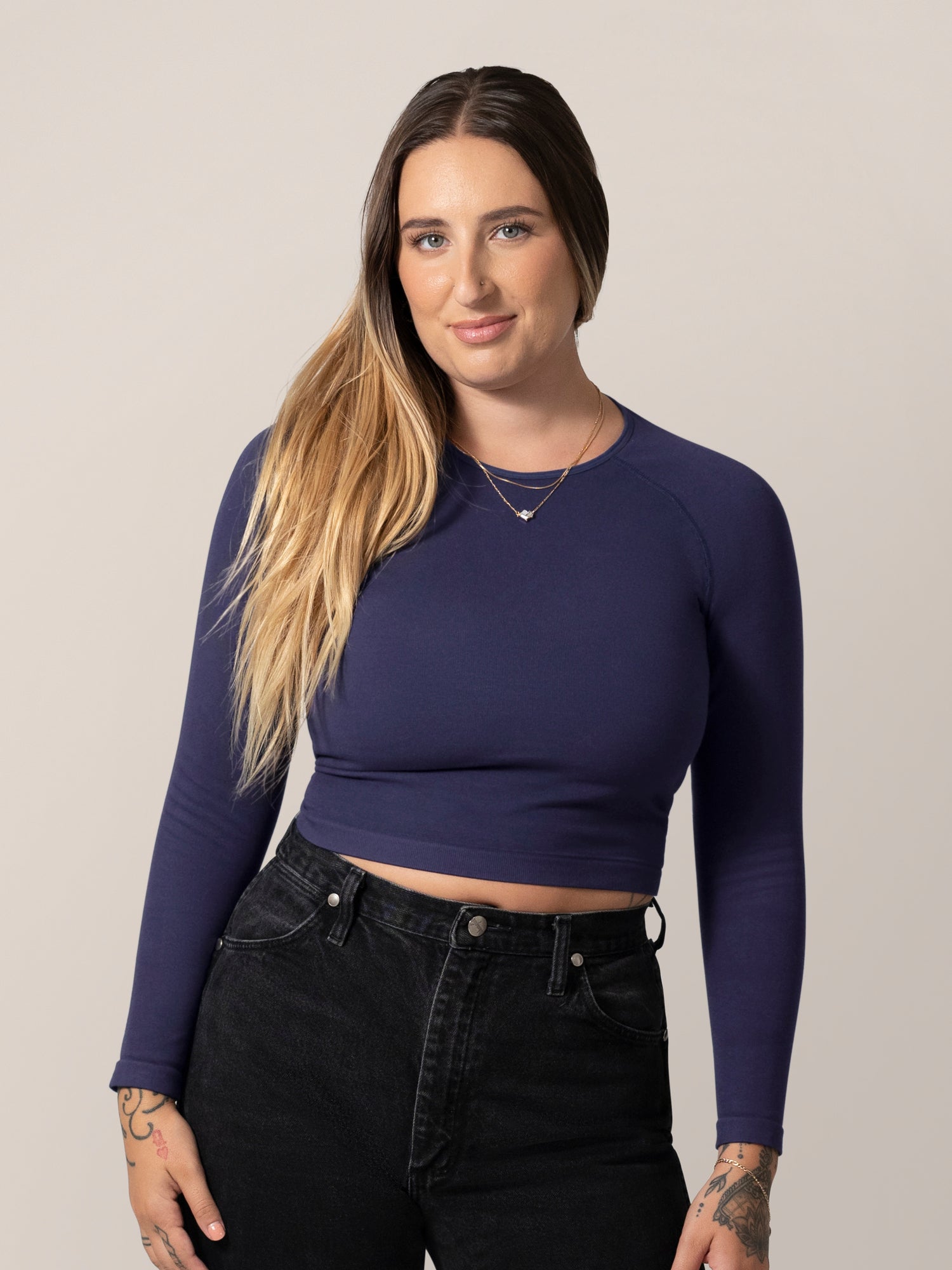 Front view of model wearing the Sublime® Bamboo Maternity & Nursing Cropped Long Sleeve Top in Navy. @model_info:Anna is wearing a Small.