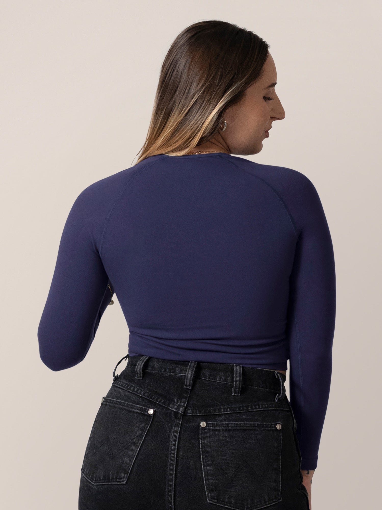Back view of model wearing the Sublime® Bamboo Maternity & Nursing Cropped Long Sleeve Top in Navy. 