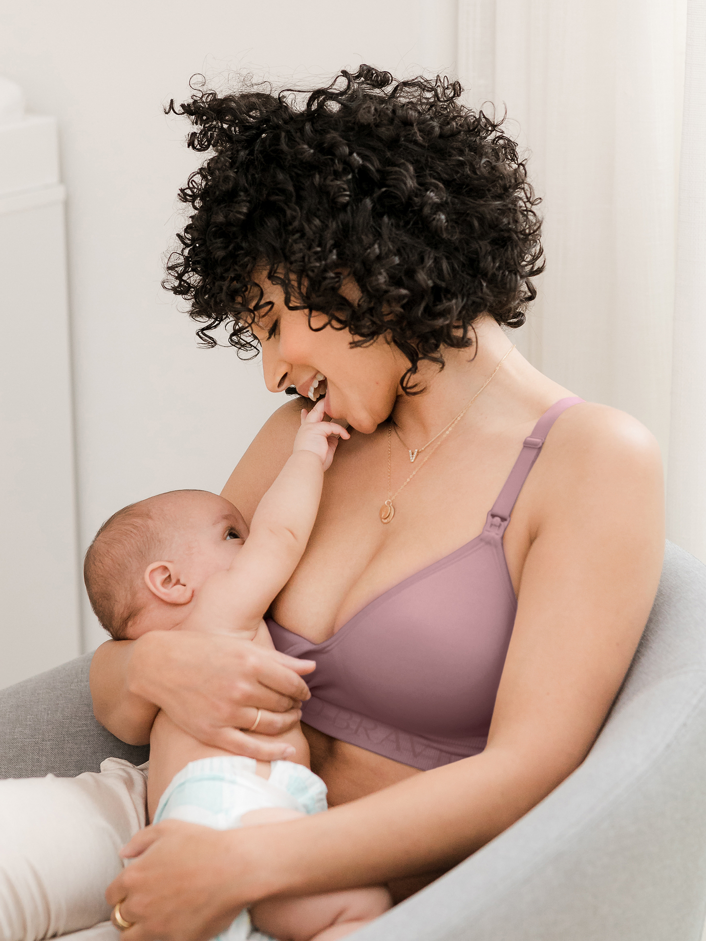 Model breastfeeding her baby while wearing the Signature Sublime® Contour Maternity & Nursing Bra in Twilight @model_info:Arion is wearing a Small.