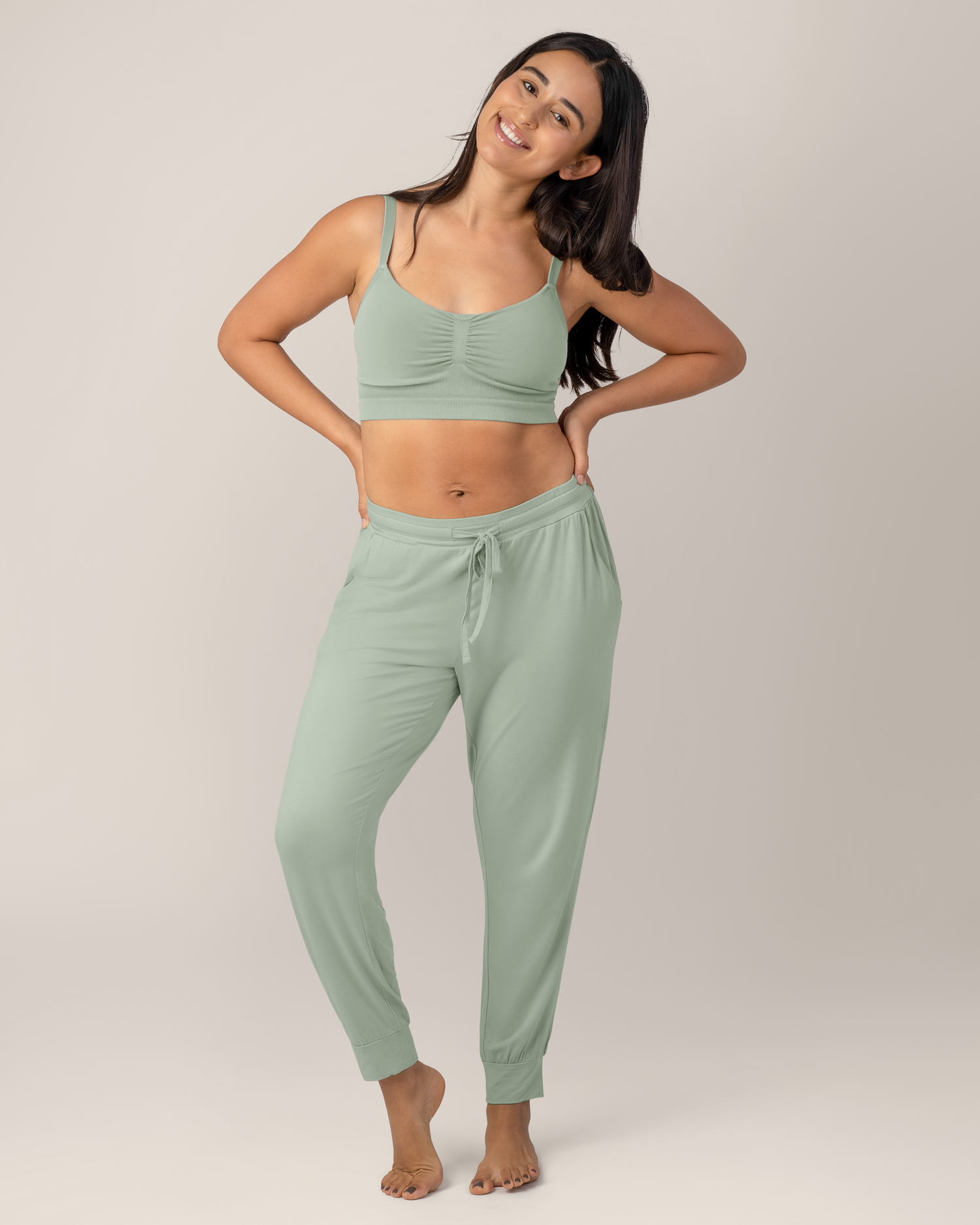 Front view of model Model standing wearing the  Sublime® Bamboo Hands-Free Pumping Lounge & Sleep Bra in Aqua with matching Everyday Lounge Jogger