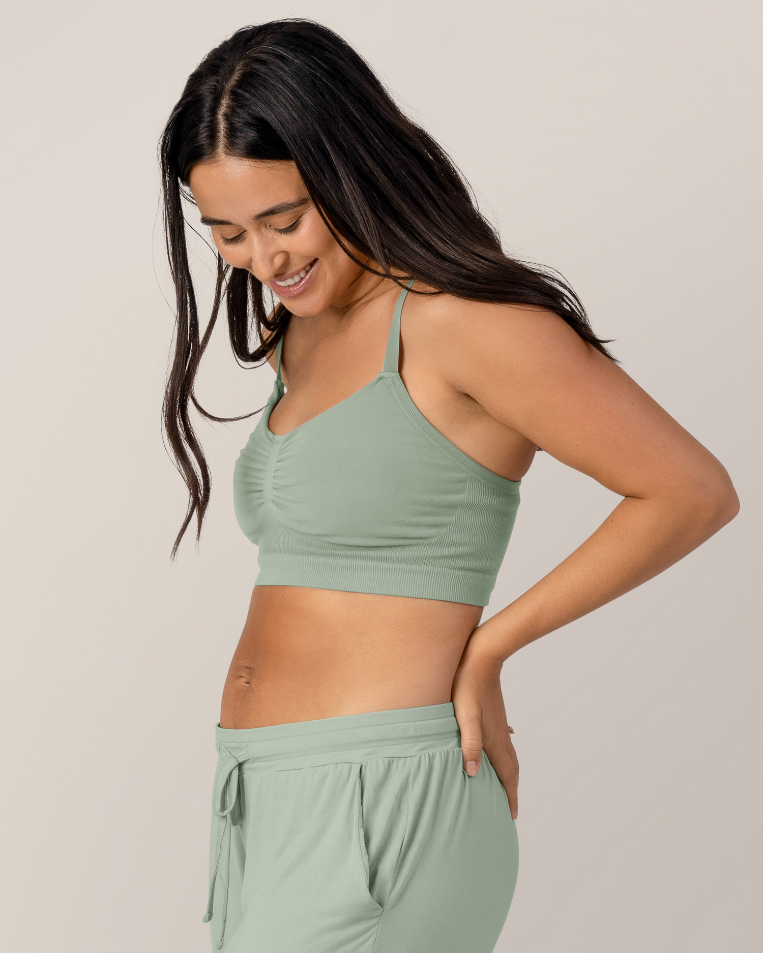 Side view of model Model wearing the  Sublime® Bamboo Hands-Free Pumping Lounge & Sleep Bra in Aqua Mist