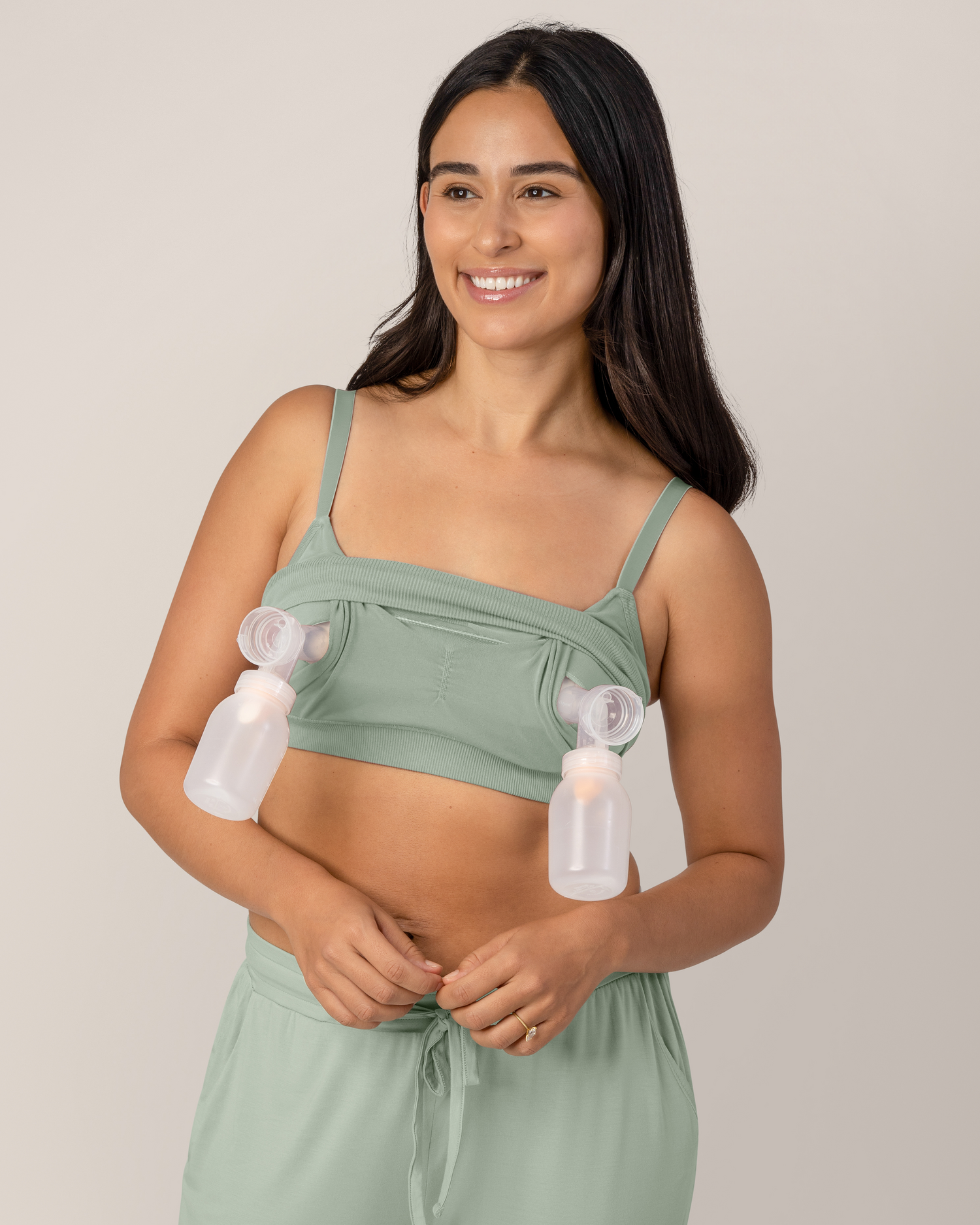 Front view of model Model pumping while wearing the  Sublime® Bamboo Hands-Free Pumping Lounge & Sleep Bra in Aqua Mist 