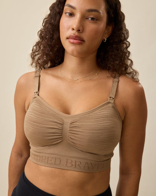 Model in the Sublime® Hands-Free Pumping & Nursing Bra in Latte on neutral background. @model_info:Mei is wearing a Small.