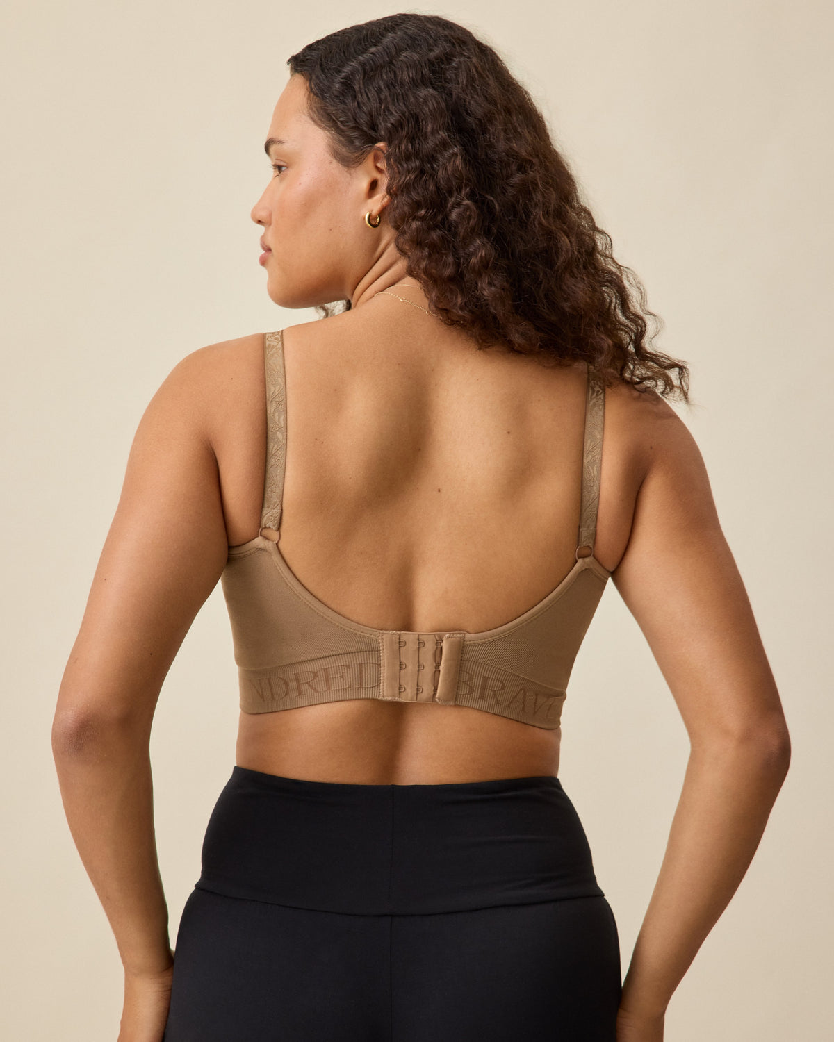 Model in the Sublime® Hands-Free Pumping & Nursing Bra in Latte on neutral background.
