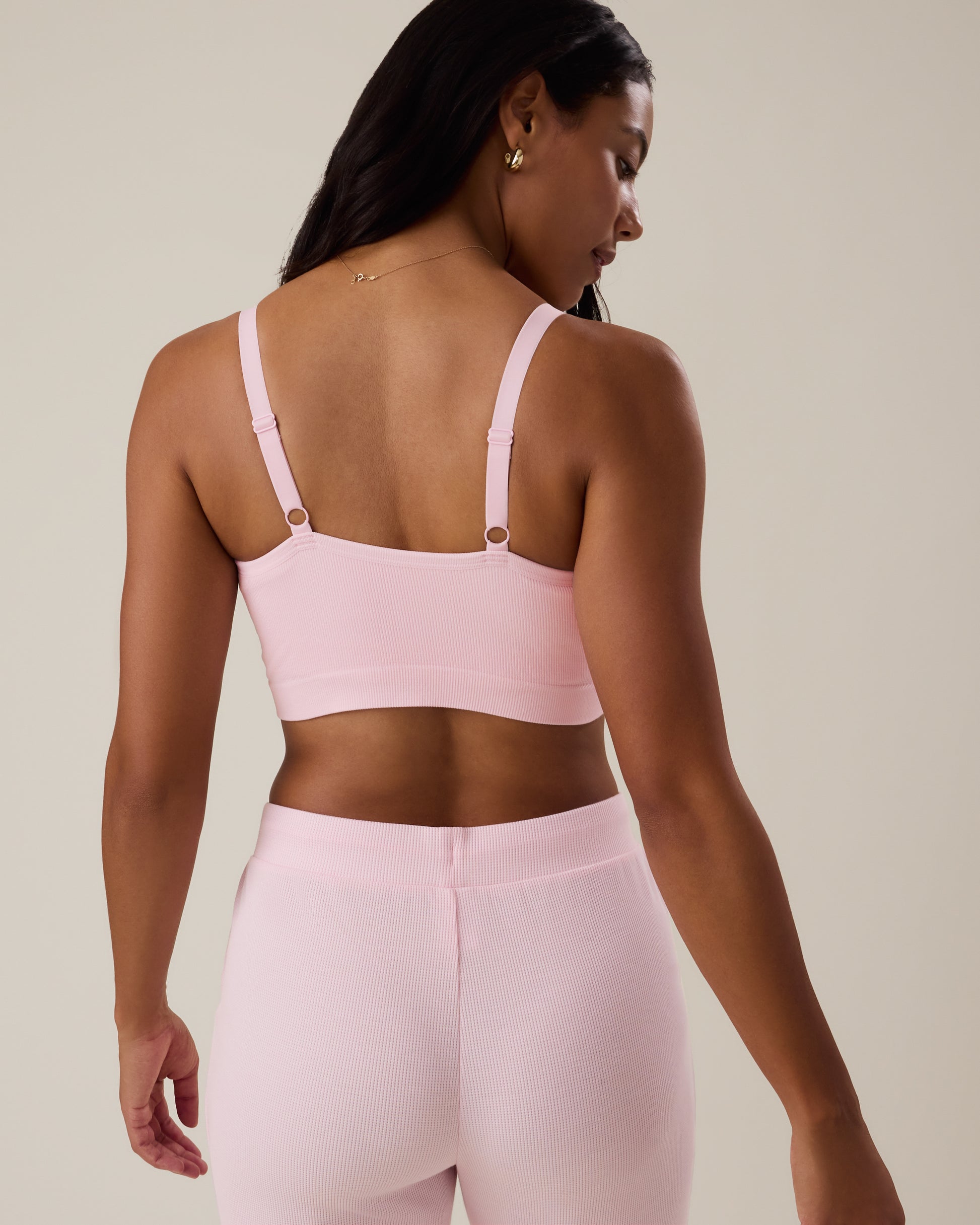 Back of woman wearing the Sublime® Bamboo Hands-Free Pumping Lounge & Sleep Bra in pale pink