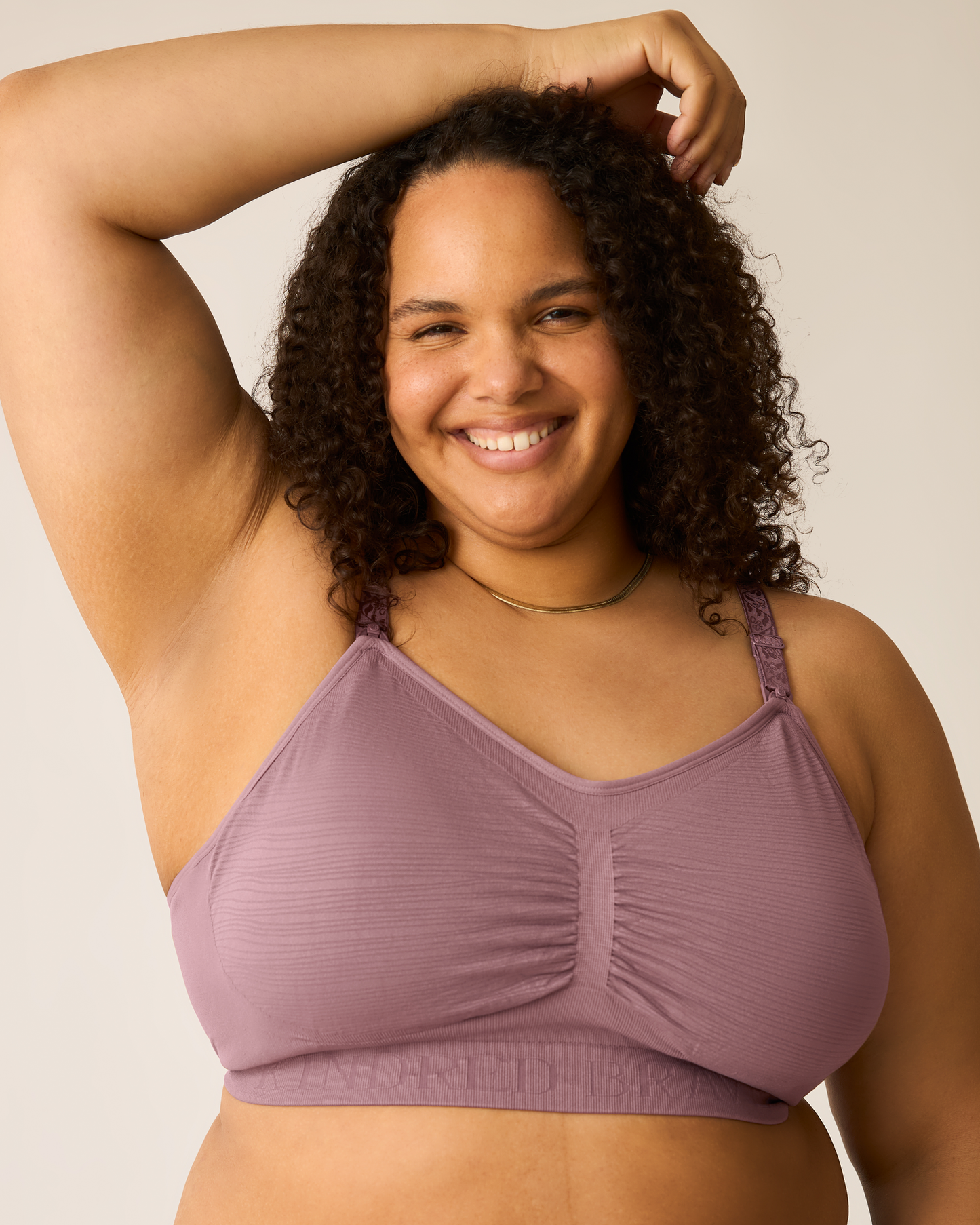 Woman wearing the Sublime® Hands-Free Pumping & Nursing Bra in Twilight against a plain background