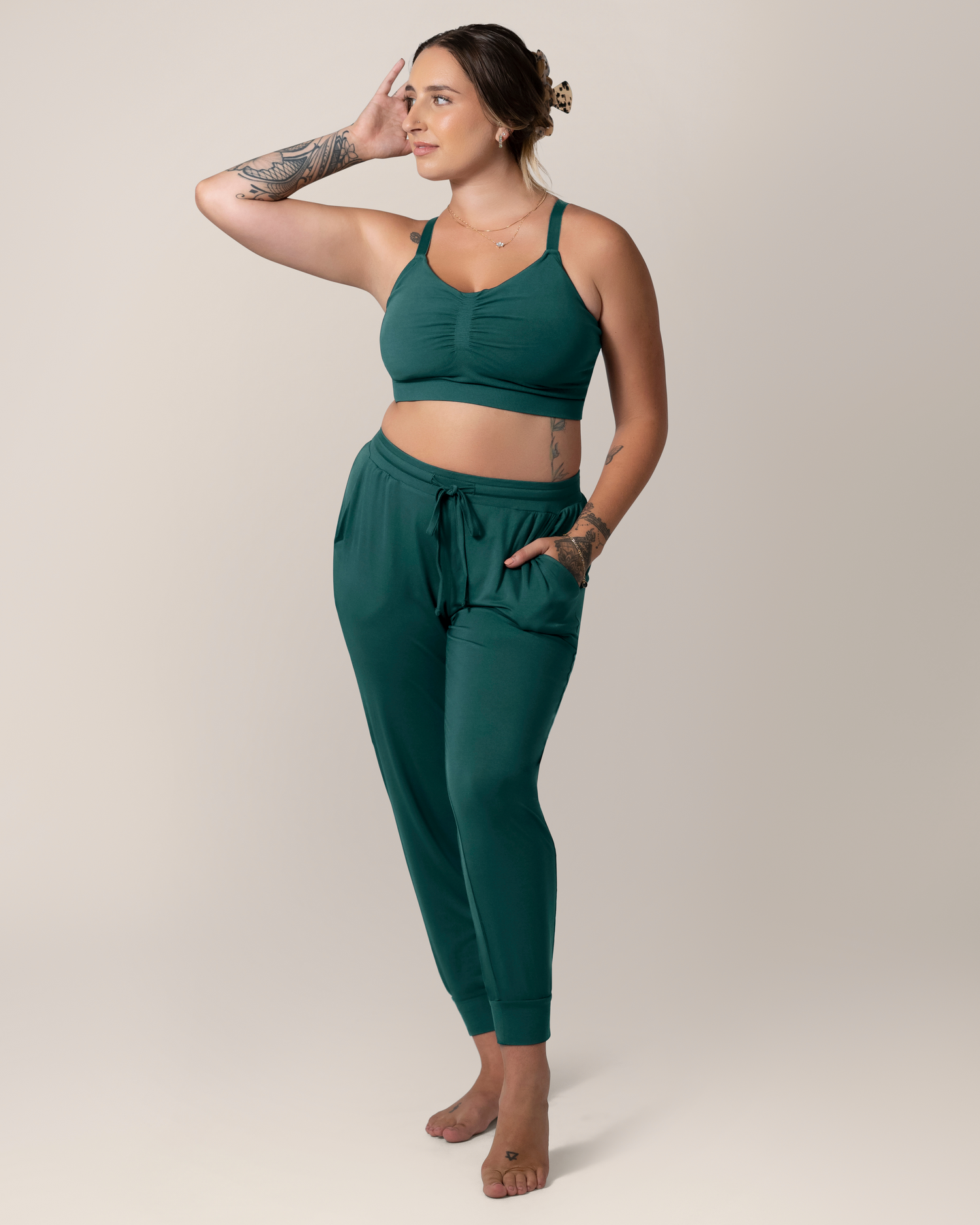 Front view of model wearing the Everyday Lounge Jogger in Evergreen, paired with matching Sublime® Bamboo Hands-Free Pumping Lounge & Sleep Bra@model_info:Anna is wearing a Medium.