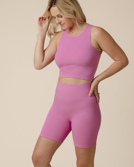 Model wearing the Sublime® Bamboo Maternity & Postpartum Bike Short in Soft Fuchsia, paired with matching Sublime® Bamboo Maternity & Nursing Longline Bra Top @model_info:Maddy is wearing a Small.
