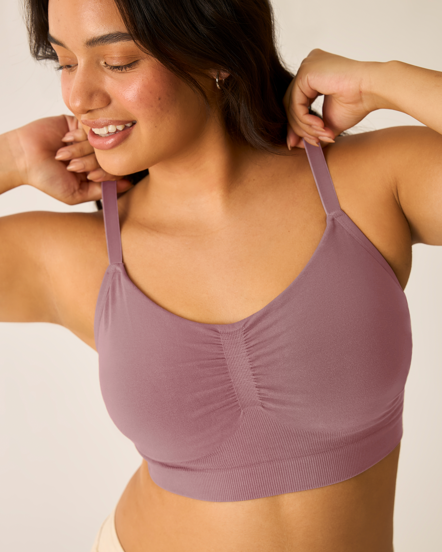 Woman wearing Sublime® Bamboo Hands-Free Pumping Lounge & Sleep Bra in Twilight against a neutral background