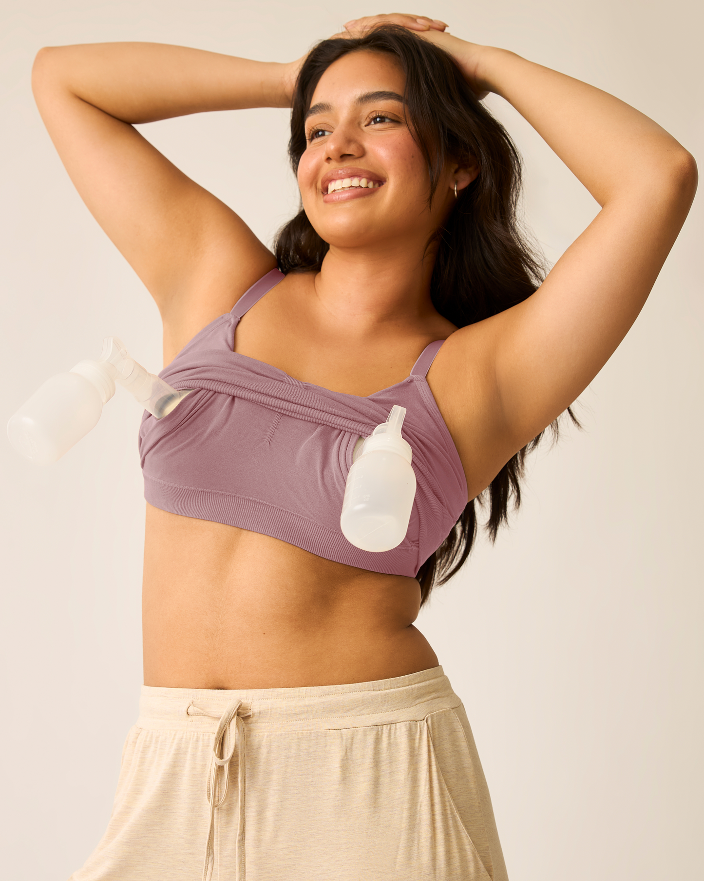 Woman wearing Sublime® Bamboo Hands-Free Pumping Lounge & Sleep Bra in Twilight with pumps inserted against a neutral background