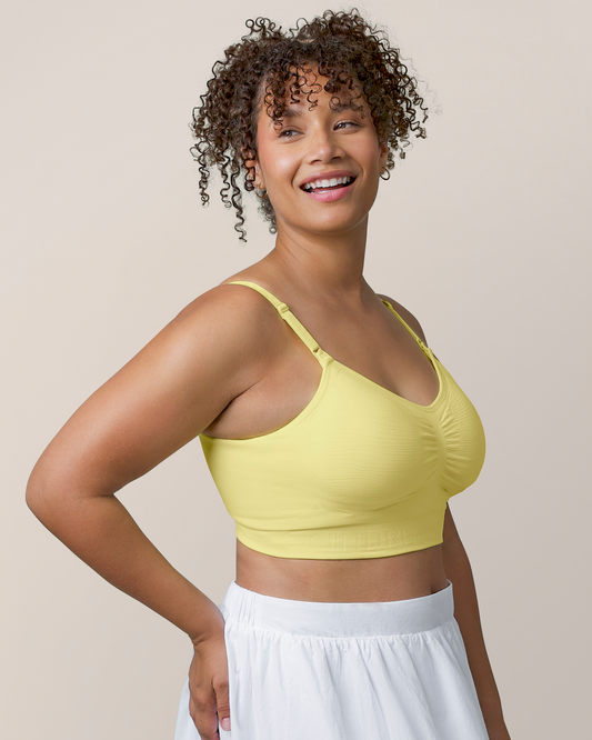 Side view of model wearing the Sublime® Hands-Free Pumping & Nursing Bra Light Lemon @model_info:Alysha is wearing a Large.