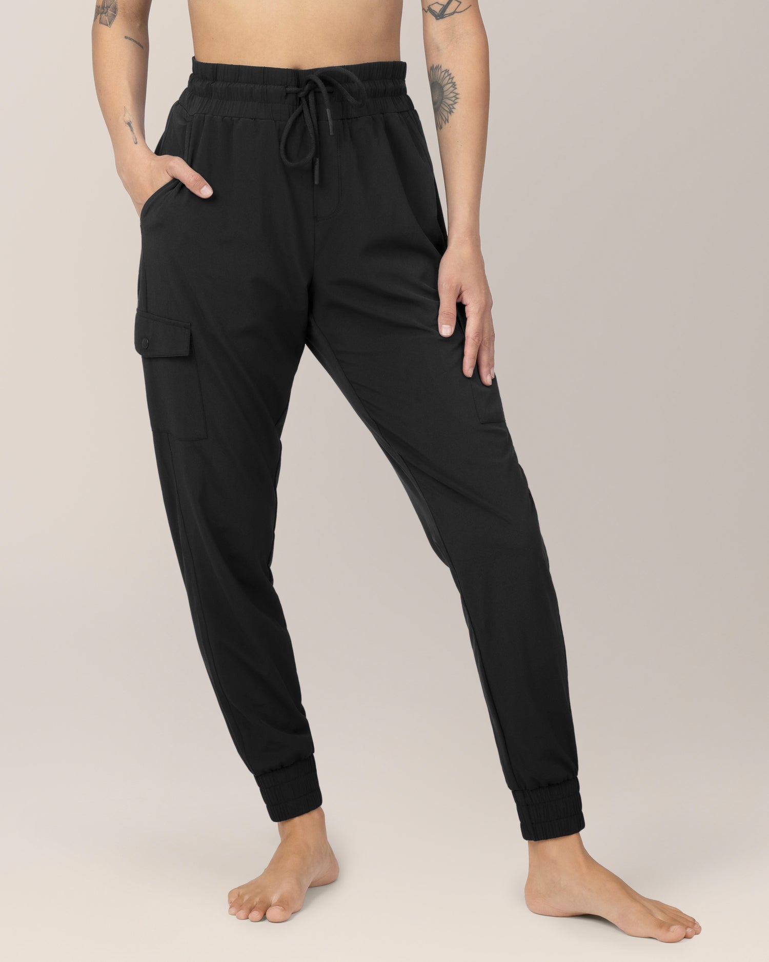 Front view of Model wearing the Remy Maternity & Postpartum Cargo Jogger in Black with matching Presley Active Zip Front Nursing Top @model_info:Ezmie is 5'6" and wearing a Small.