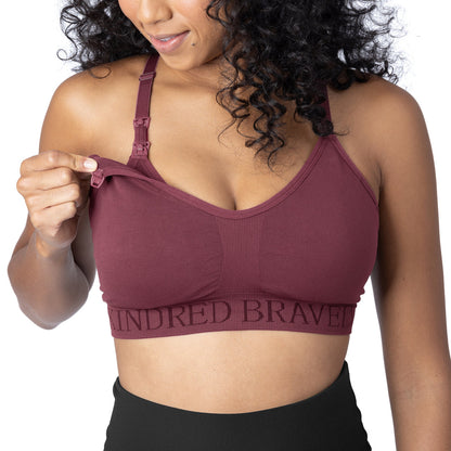 Model wearing the Sublime® Hands-Free Pumping & Nursing Sports Bra in fig showing the clip down pumping access.