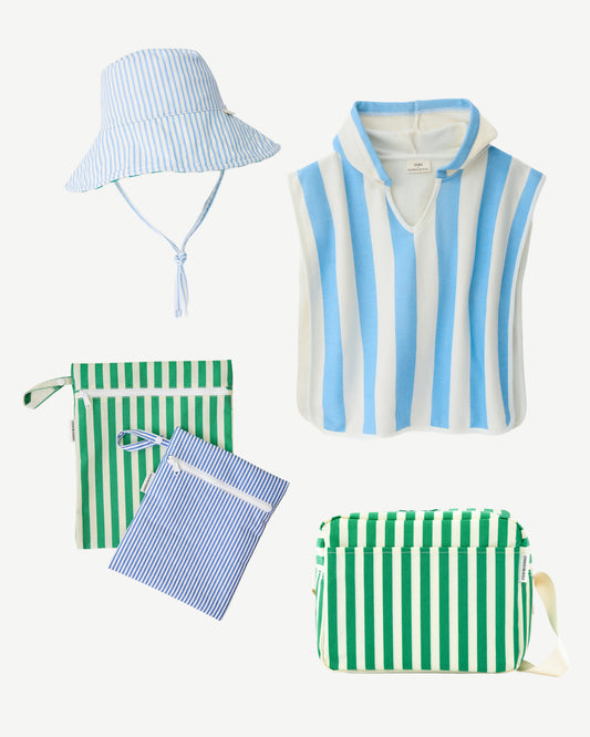 Summer Bag Must Haves include: Organic Cotton Toddler Poncho Towel, Big Floppy Sun Hat, Mini Cooler Bag, and Wet/Dry Bag Set, on a beige background.