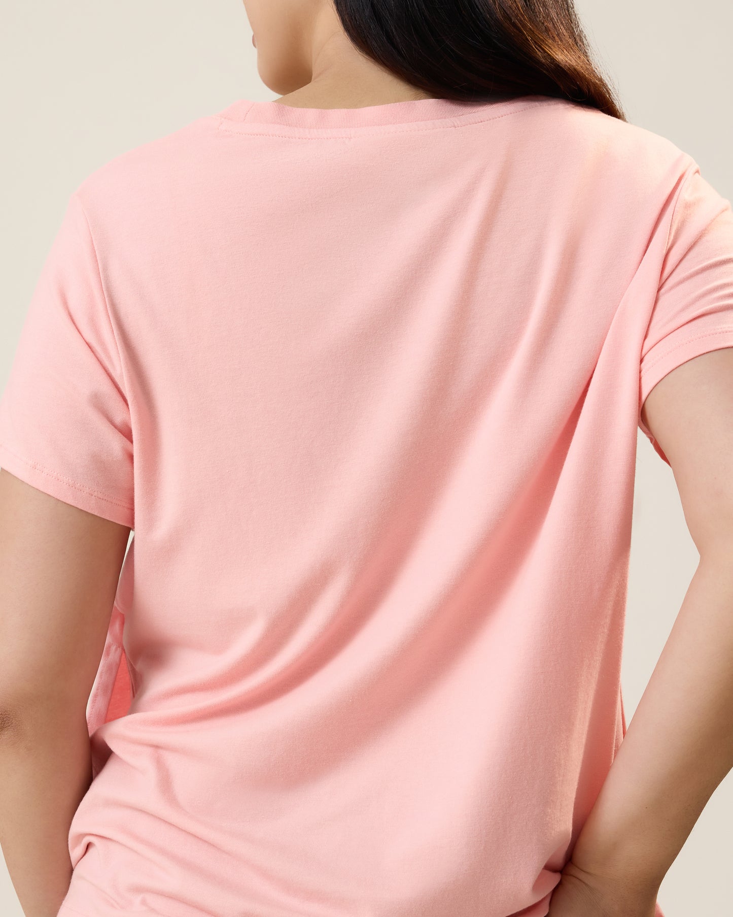Back view of model wearing Classic Modal V-neck Nursing T-shirt in Sunset Pink