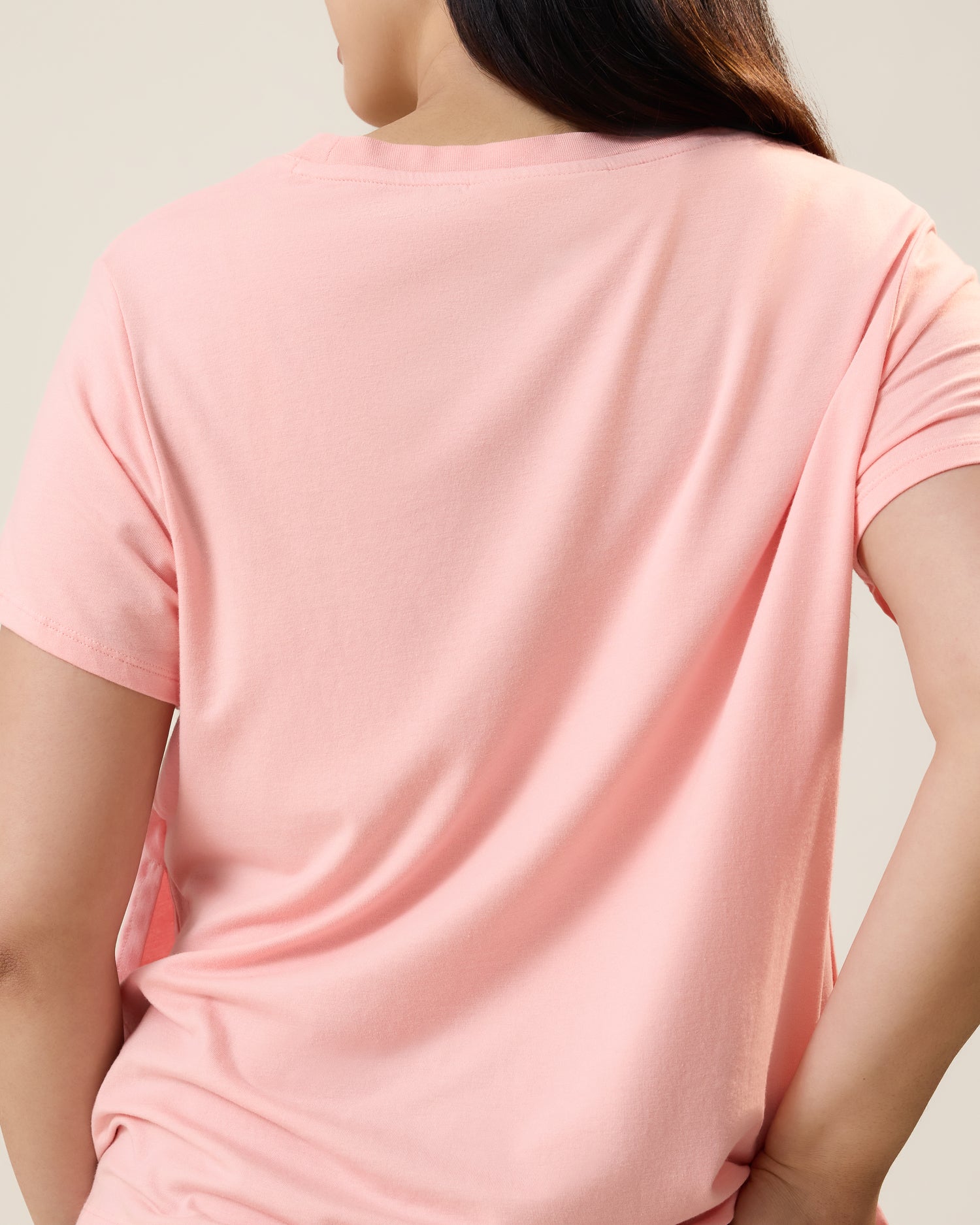 Back view of model wearing Classic Modal V-neck Nursing T-shirt in Sunset Pink
