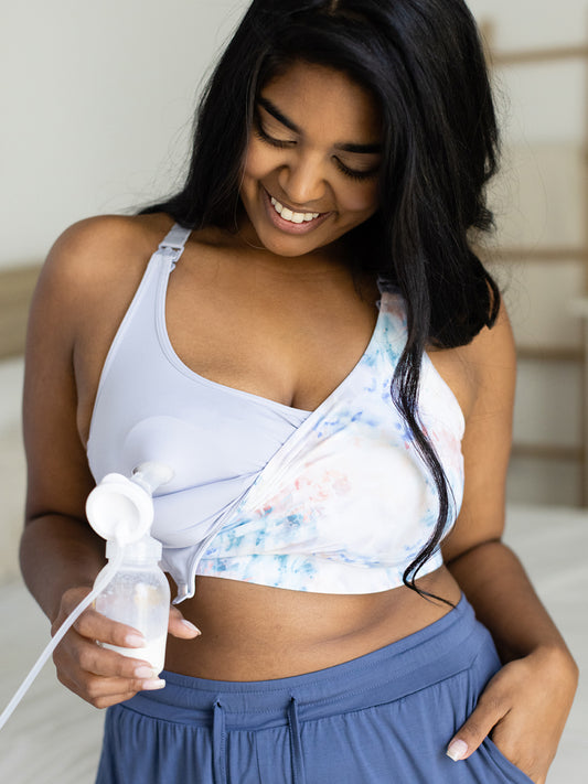 Model wearing the BFF Hands-Free Pumping & Nursing Bra attached to a pump@model_info:Ayla is wearing a Large Busty.