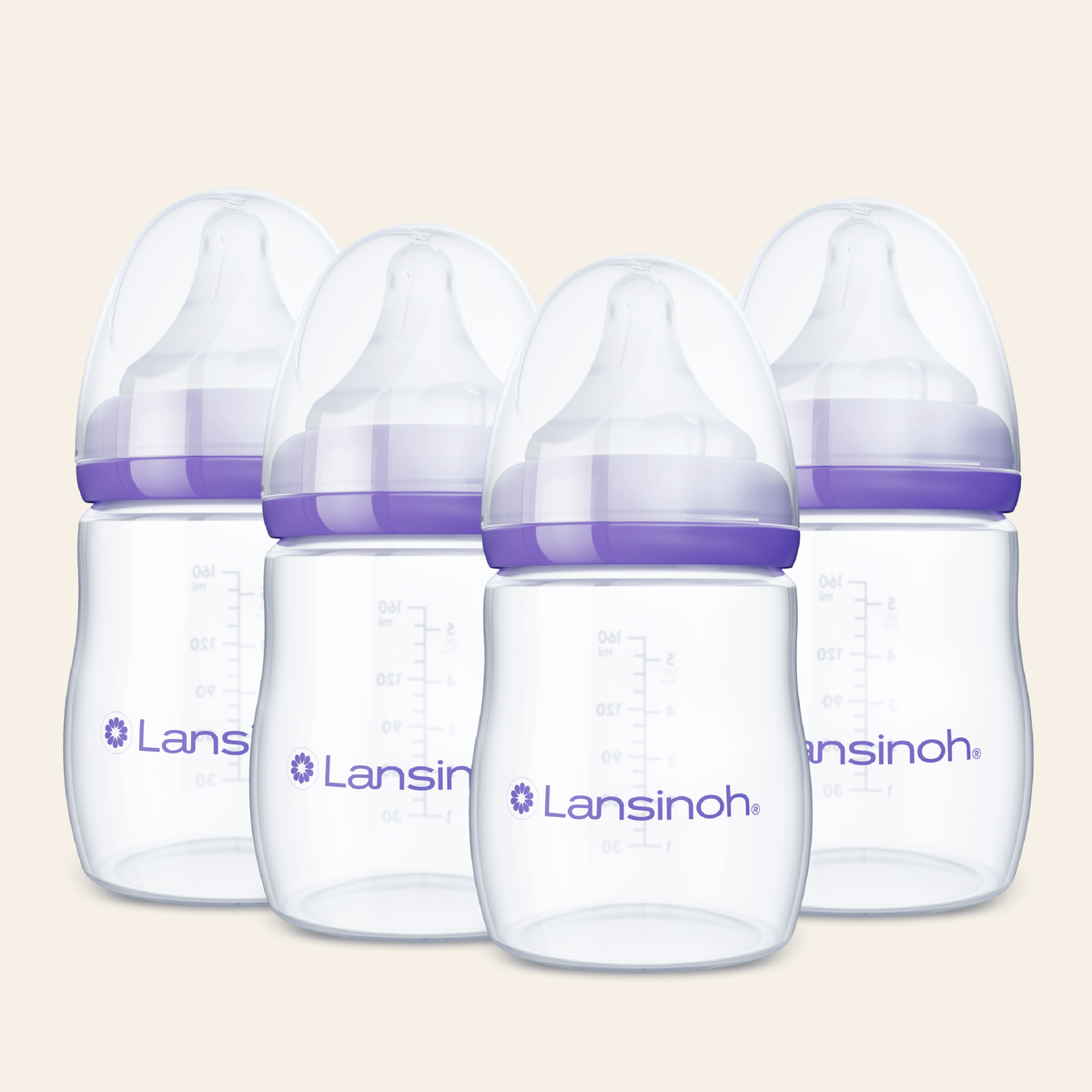 Four Lansinoh baby bottles with clear plastic bodies, purple silicone collars, and clear caps, arranged in a row against a light beige background.