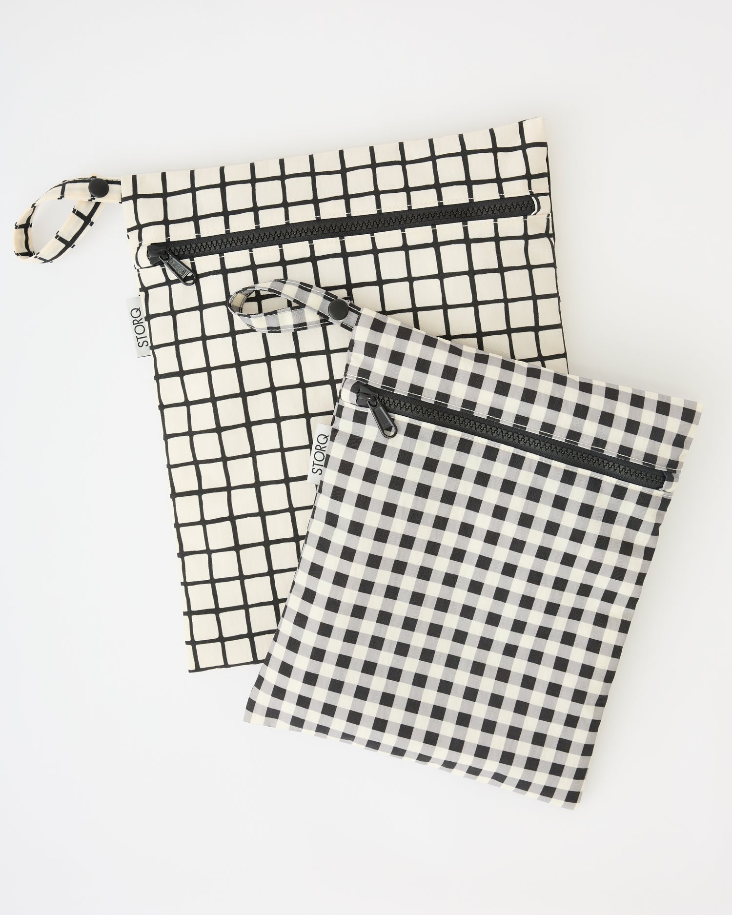 Wet/Dry Bag Set in Black Grid on a beige background.