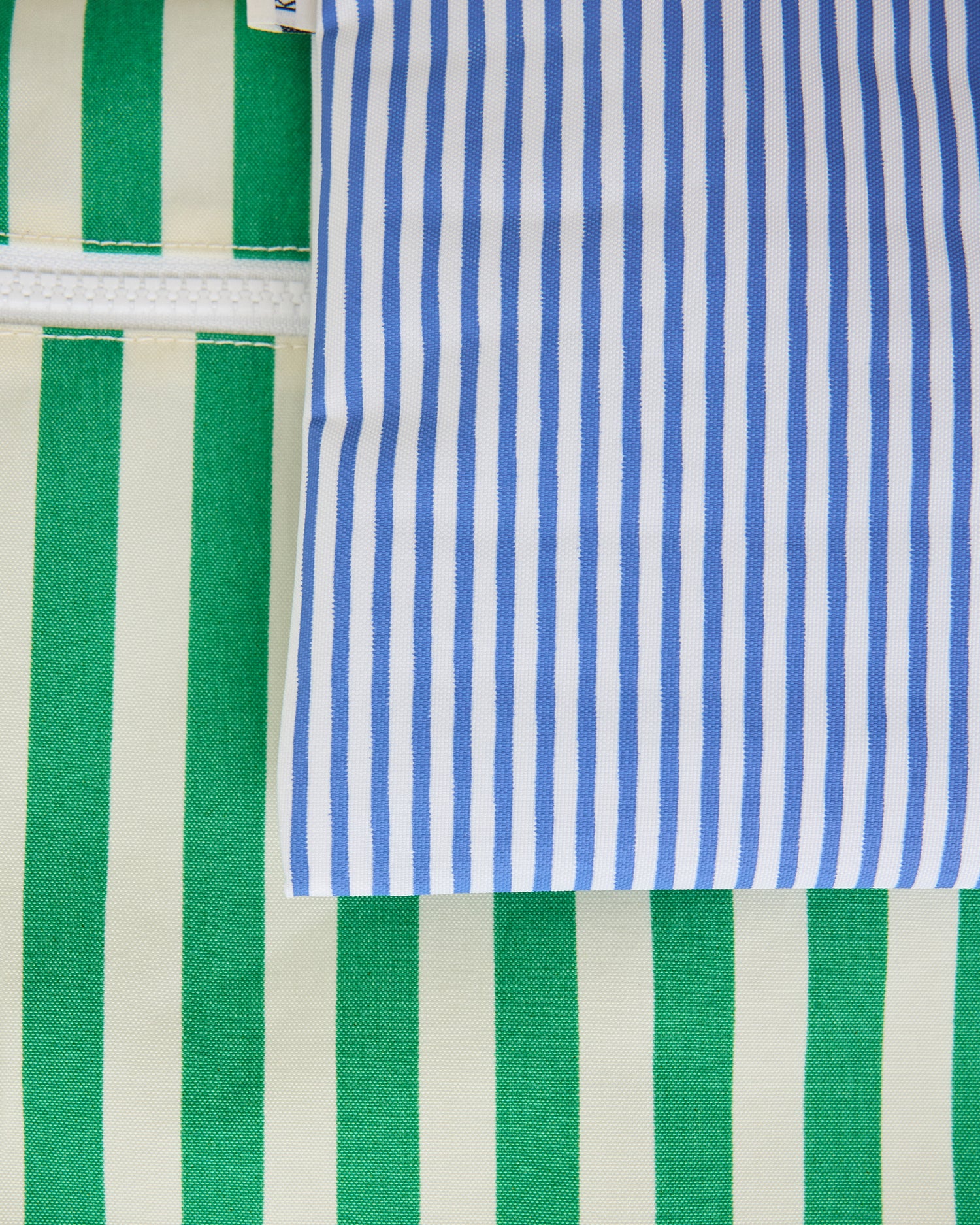 Close up of wide green stripe bag and thin blue stripe bag of Wet/Dry Bag Set in Stripe print