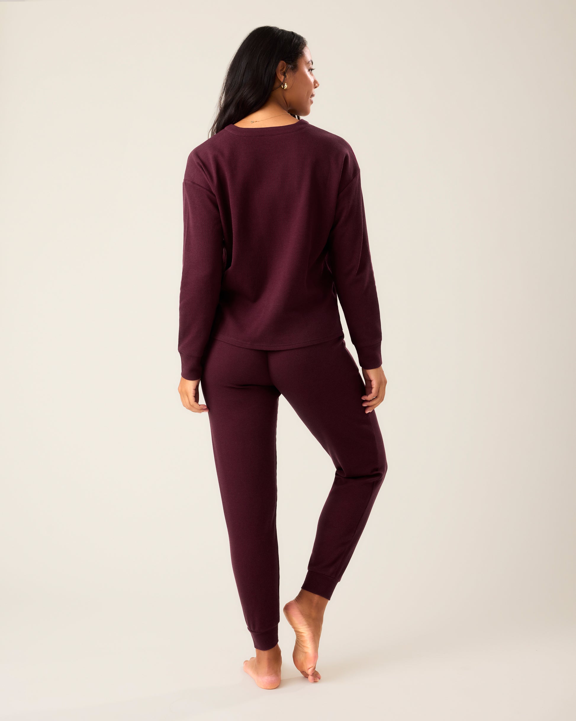 Back of woman wearing the Waffle Maternity & Nursing Lounge Set in deep burgundy 