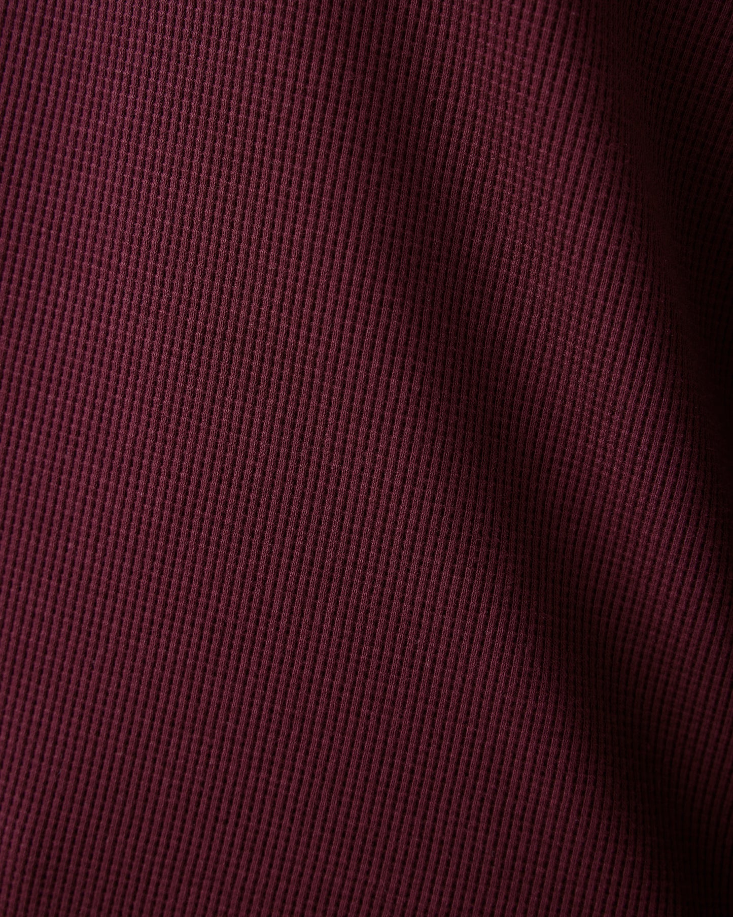 Close up fabric detail of Waffle Maternity & Nursing Lounge Set in deep burgundy showing waffle texture