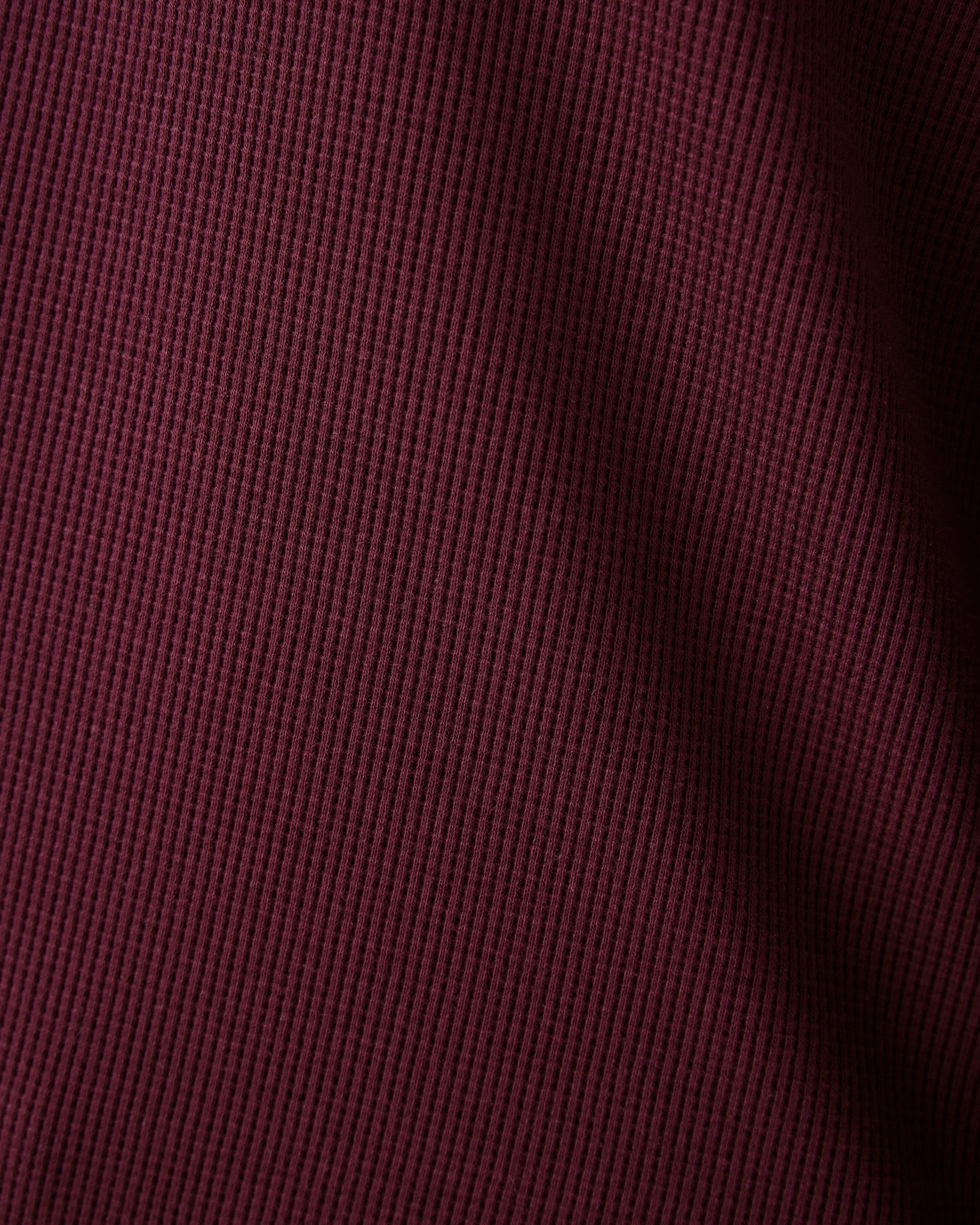 Close up fabric detail of Waffle Maternity & Nursing Lounge Set in deep burgundy showing waffle texture