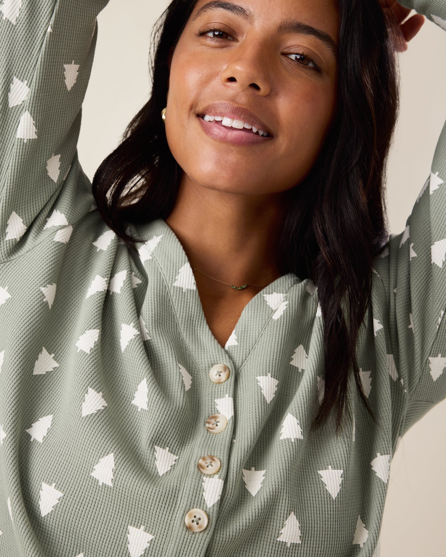 Woman wearing the top of the Waffle Maternity & Nursing Lounge Set in Sage Trees - sage green background with white tree pattern