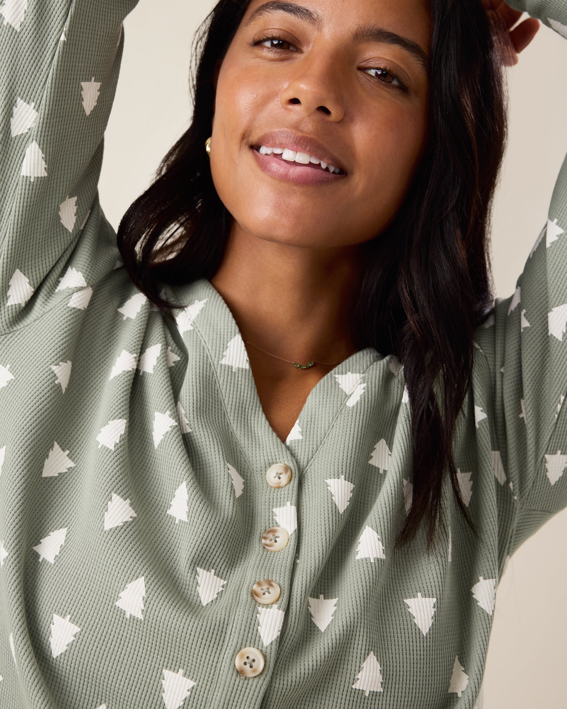 Woman wearing the top of the Waffle Maternity & Nursing Lounge Set in Sage Trees - sage green background with white tree pattern