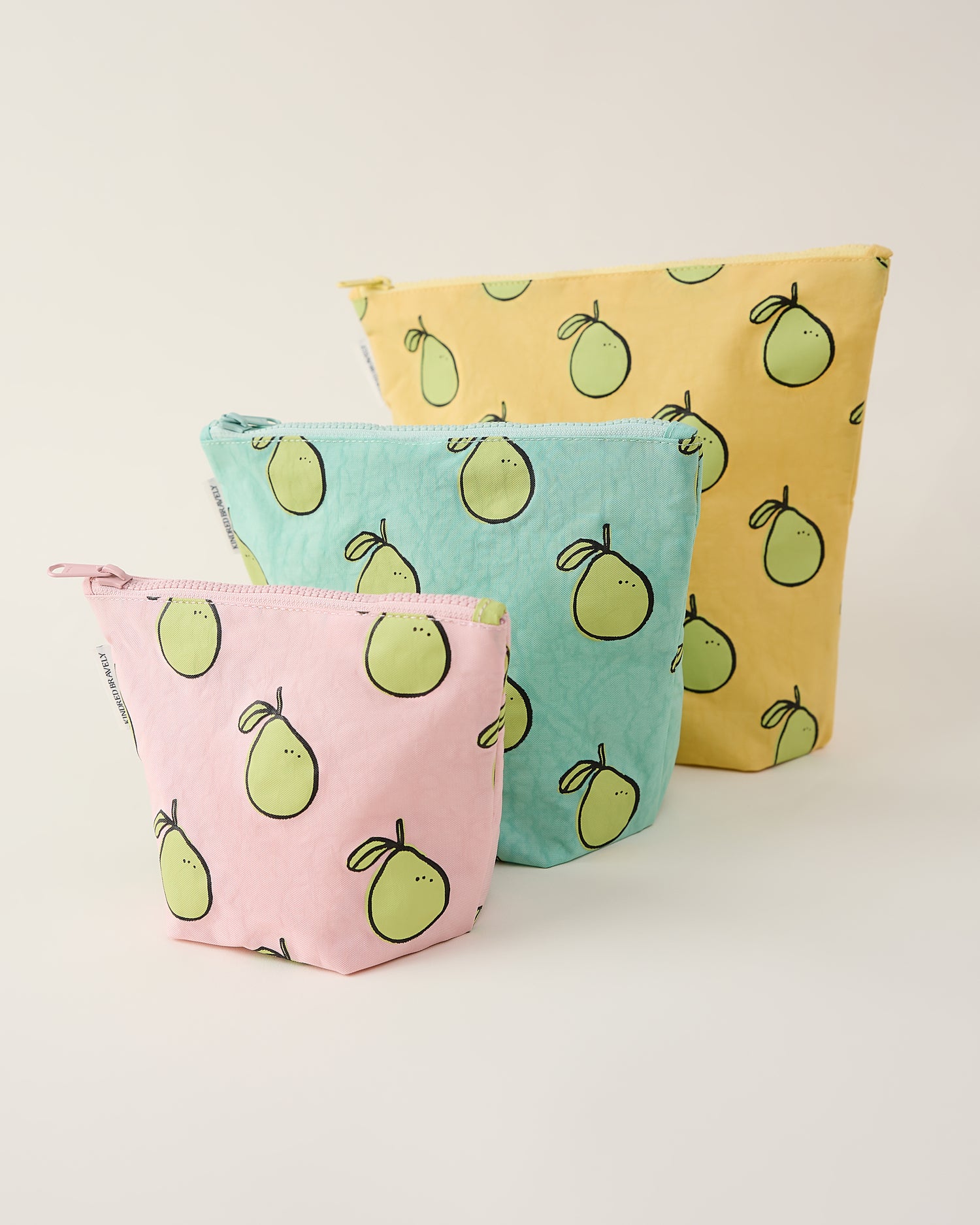 Three pouches with pomelo pattern on a light background