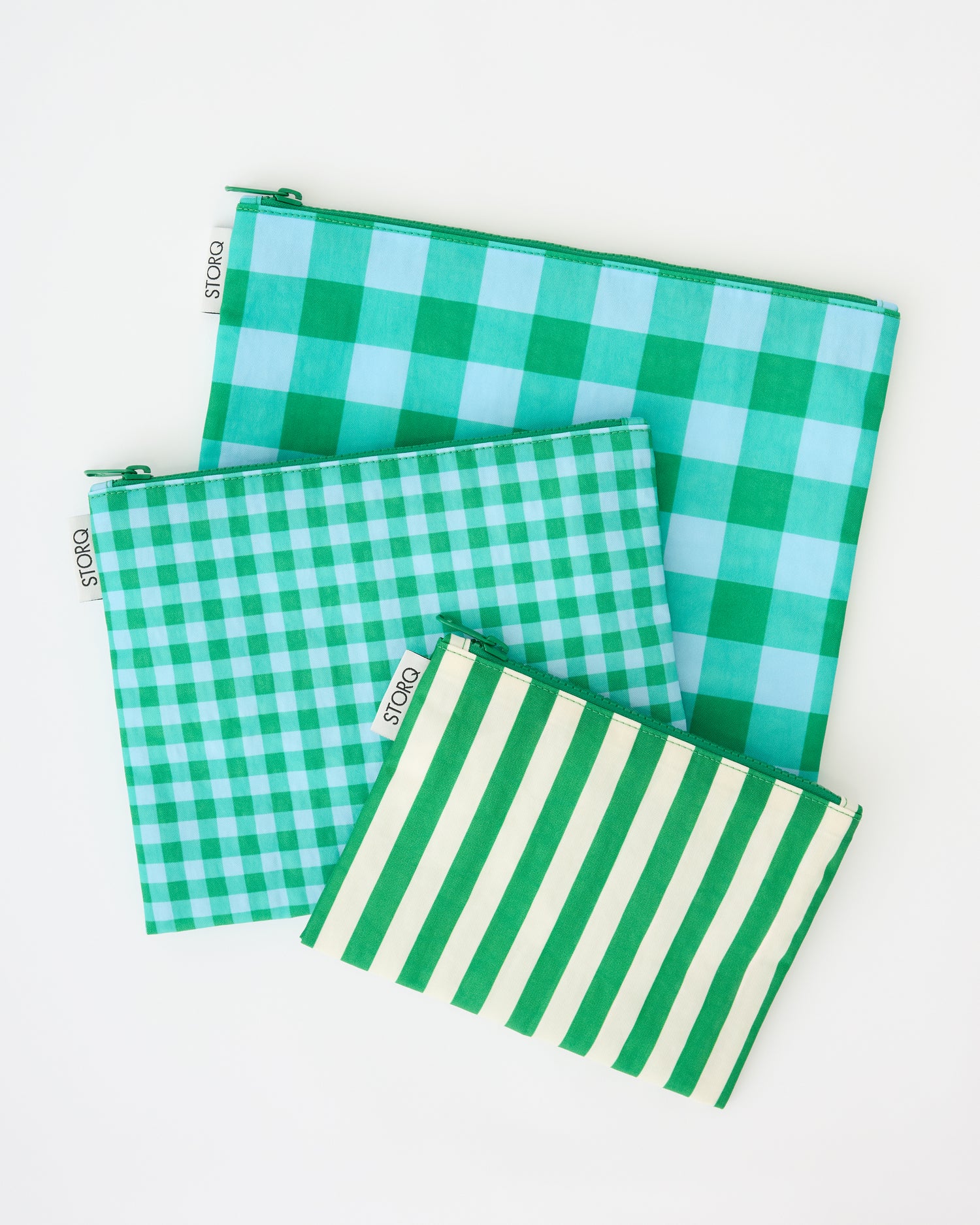 Zipper Pouch Three-Piece Set in Teal Gingham on a beige background.