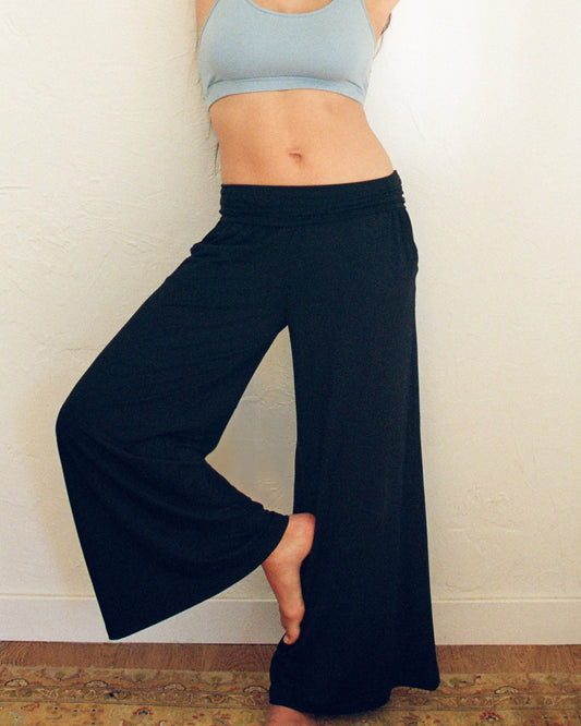 Model wearing the Bamboo Wide Leg Maternity & Postpartum Lounge Pant in black@model_info:Zoe is 5'5" and wearing a Small.