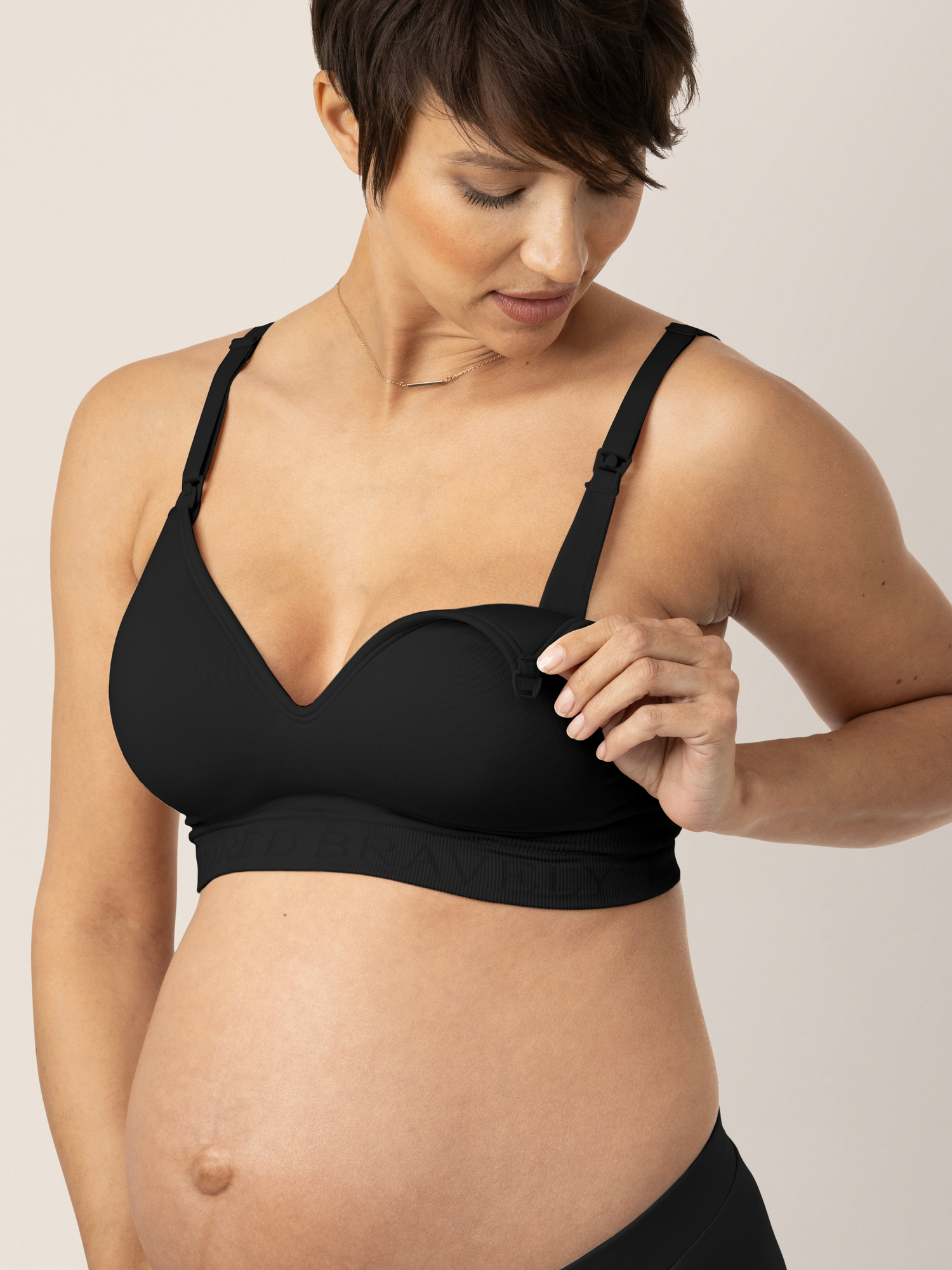 Model looking down at the easy clip down nursing on the Signature Sublime® Contour Maternity & Nursing Bra in Black