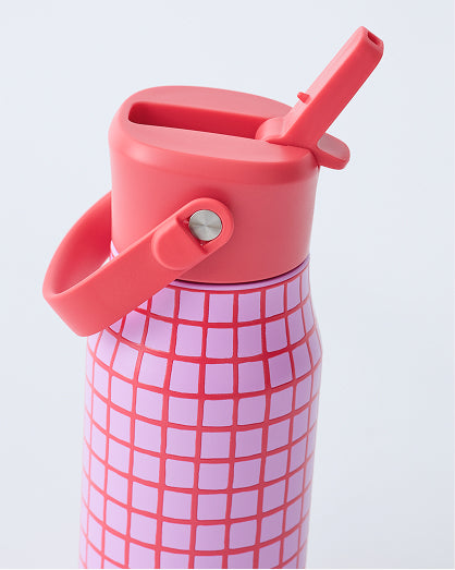 Close up of Cool Kid Water Bottle in Orchid Grid on a beige background.