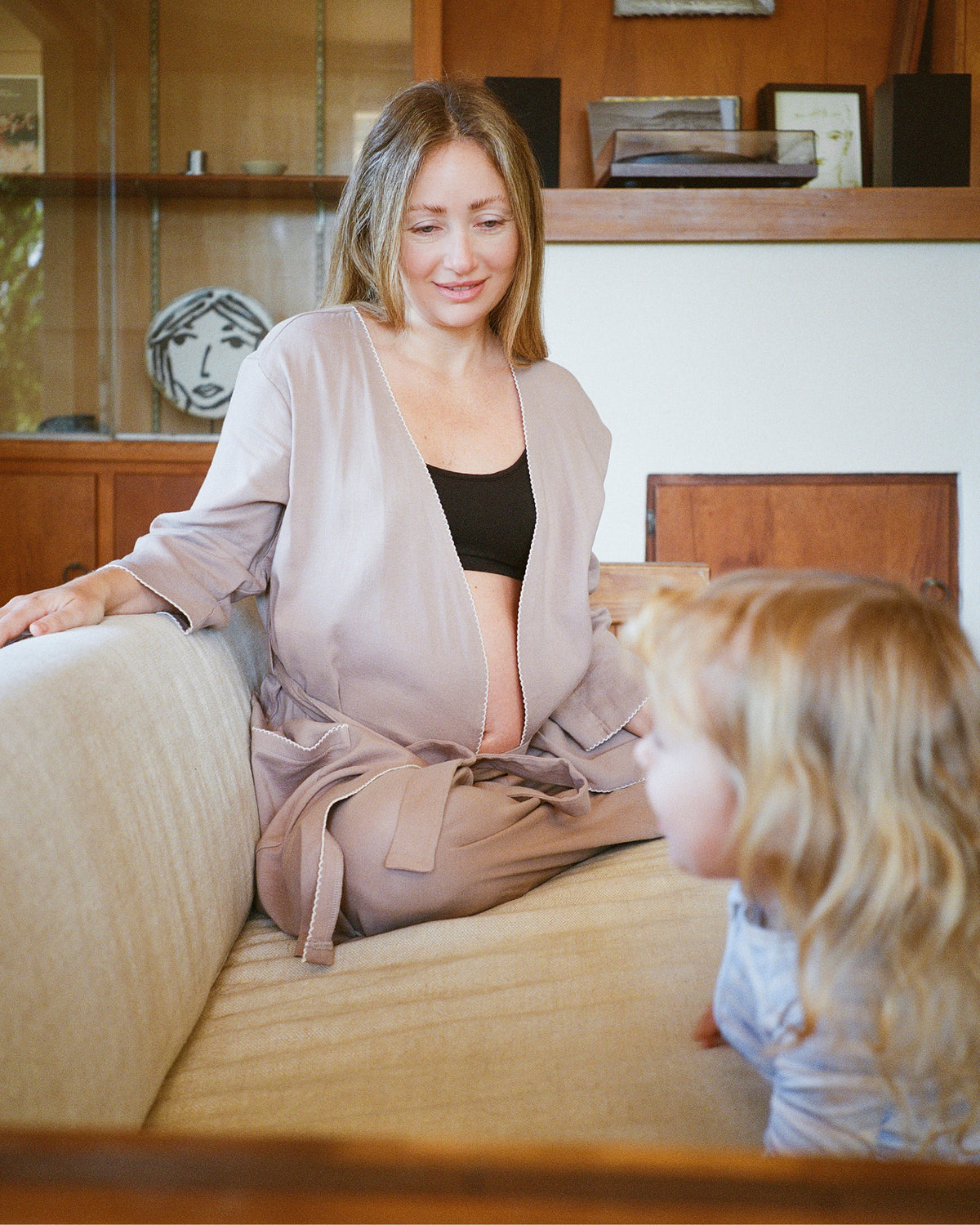 Model wearing French Terry Maternity & Nursing Bralette in Black against a neutral background@model_info:Kate is wearing a Small.